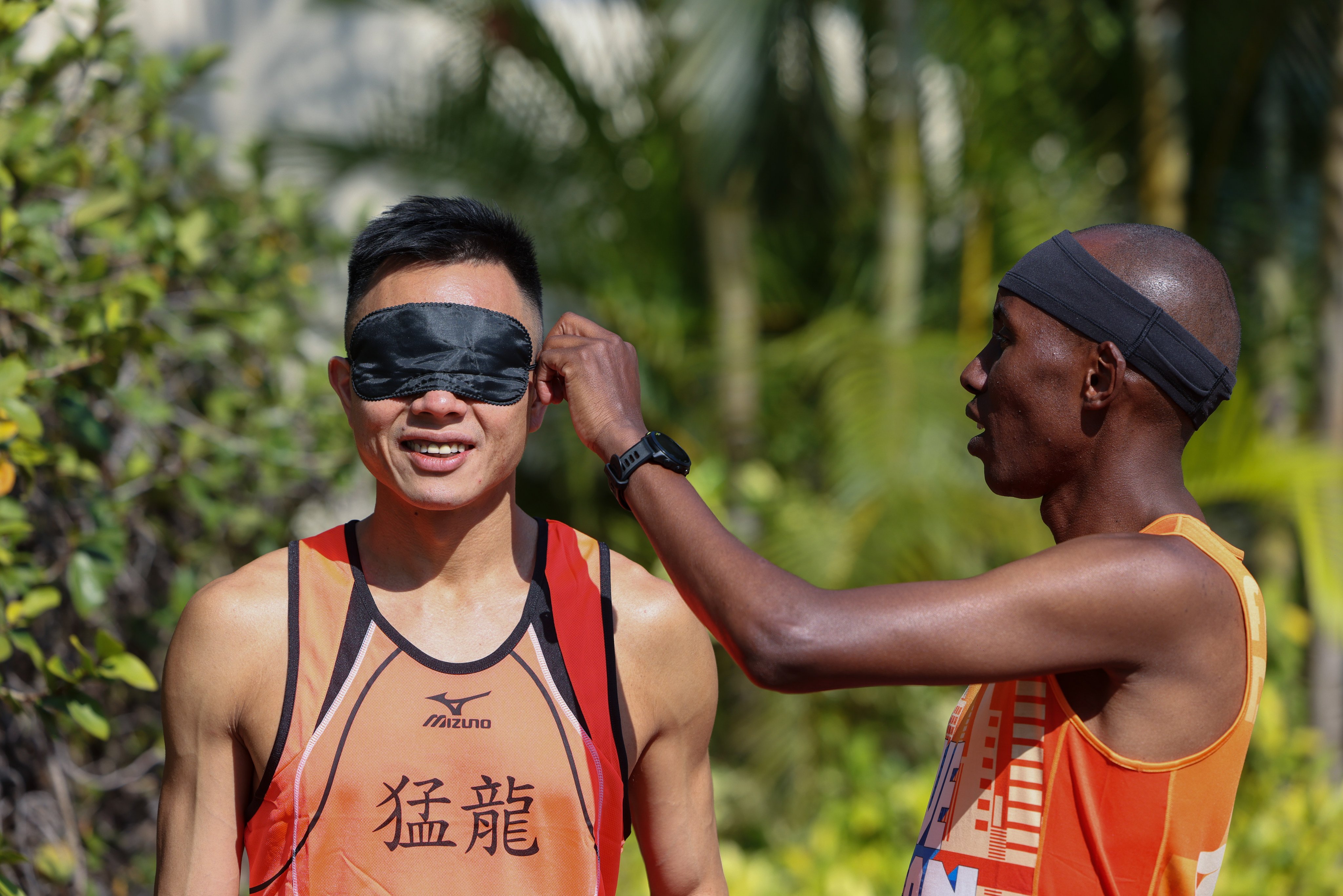 Marco Wong Sui-kam (left) will run blindfolded in the Standard Chartered Marathon this Sunday, with guide runner Lukas Wambua Muteti. Photo: Nora Tam