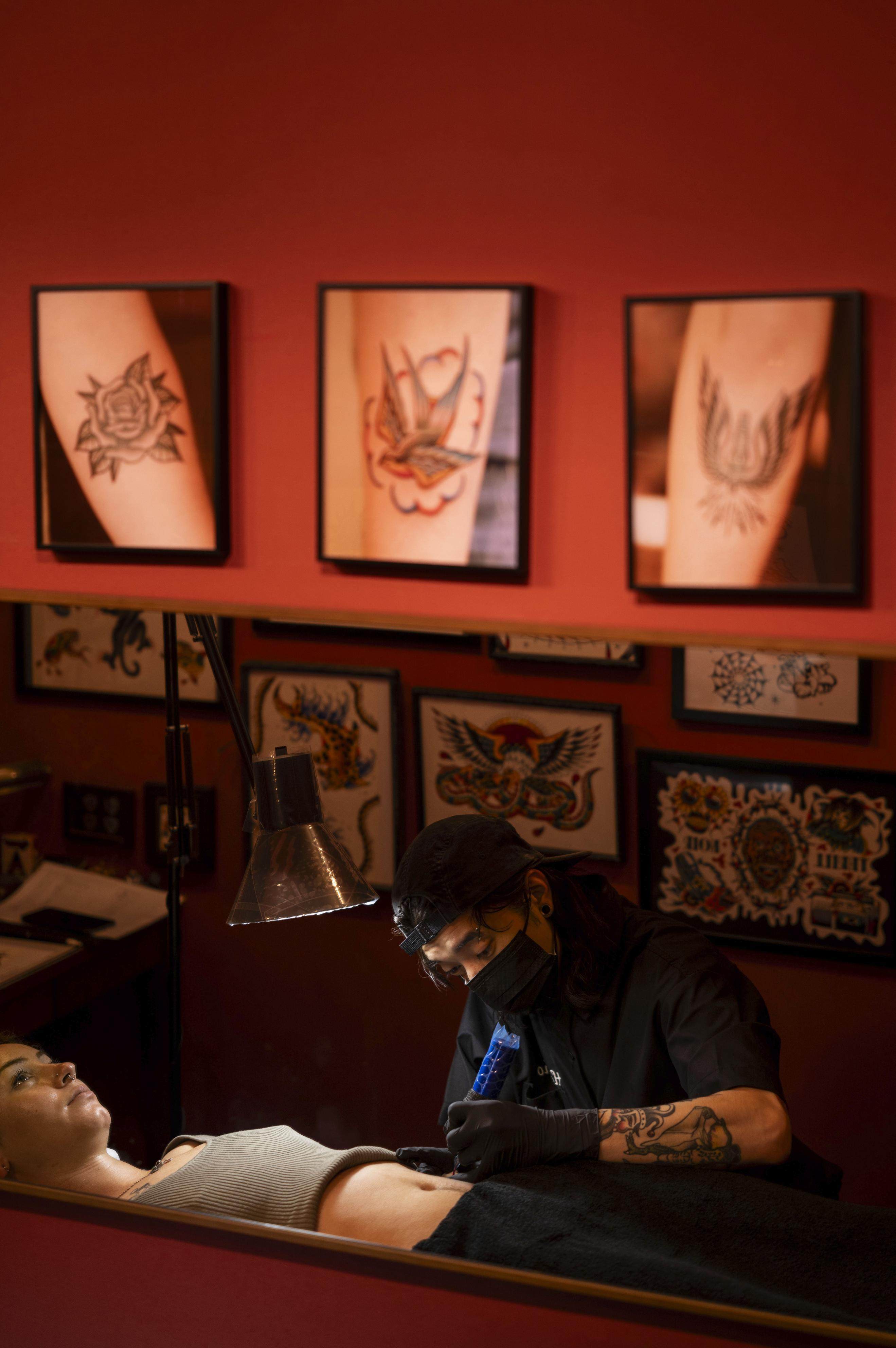 Tattoo artist Horisho works on a foreign tourist at Good Times Ink tattoo studio in Osaka. Photo: Kyodo