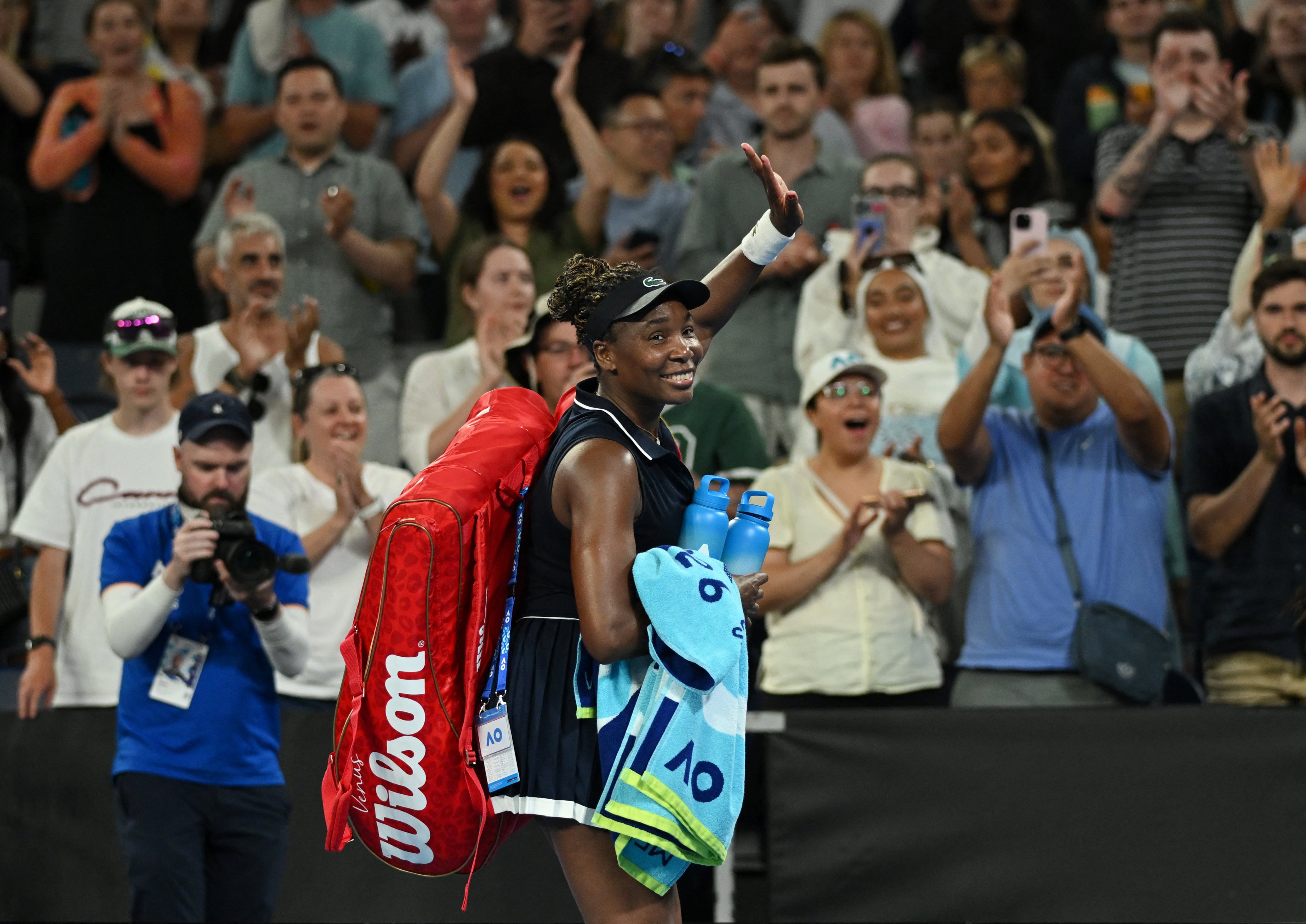 Venus Williams of the US waves as she leaves the court after her first-round loss to Serbia’s Olga Danilovic. Photo: Reuters