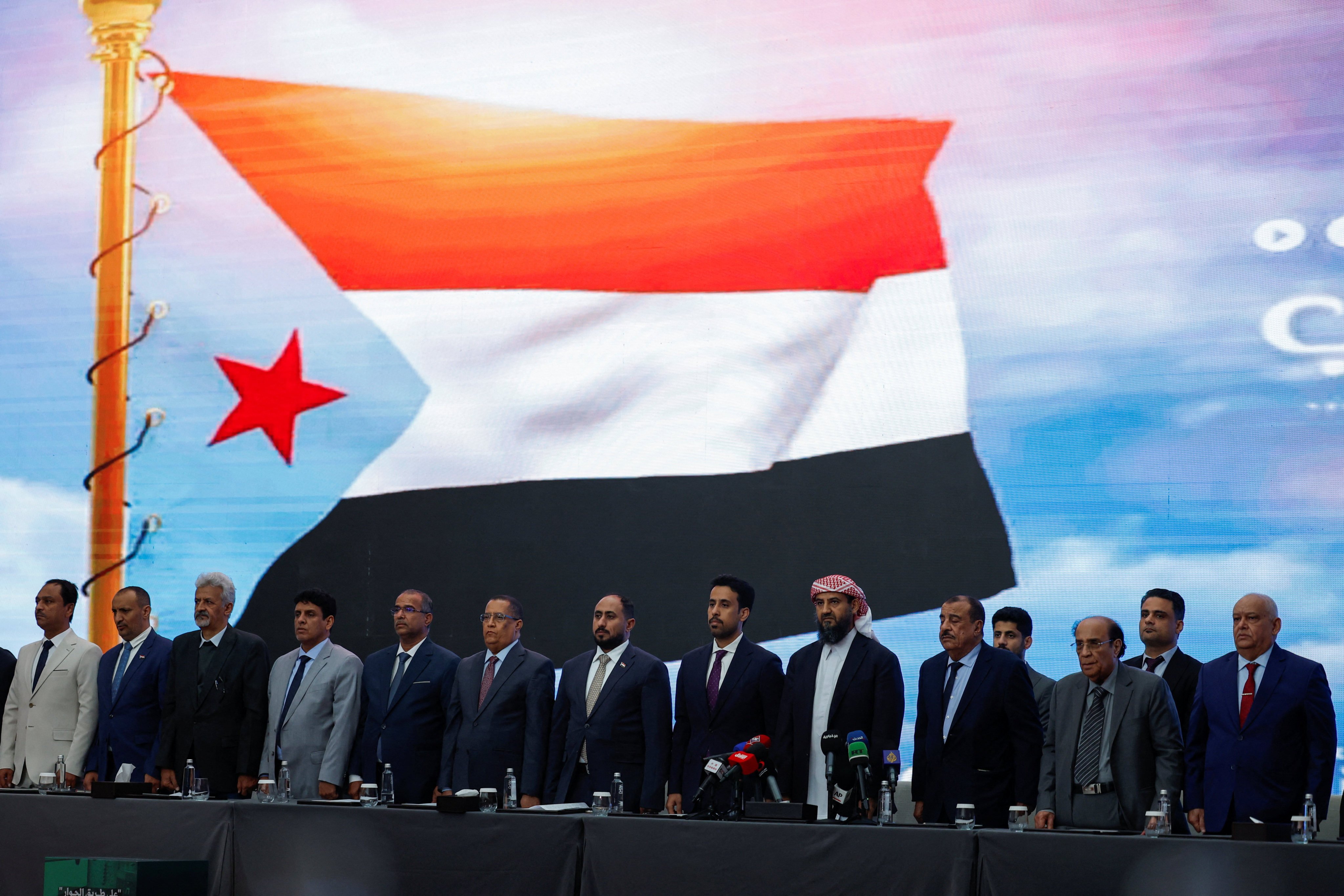 Yemen’s Presidential Leadership Council member Abdulrahman al-Mahrami along with other members from Yemen stand for Yemen’s national anthem during the Southern Consultative Meeting in Riyadh, Saudi Arabia, on Sunday. Photo: Reuters