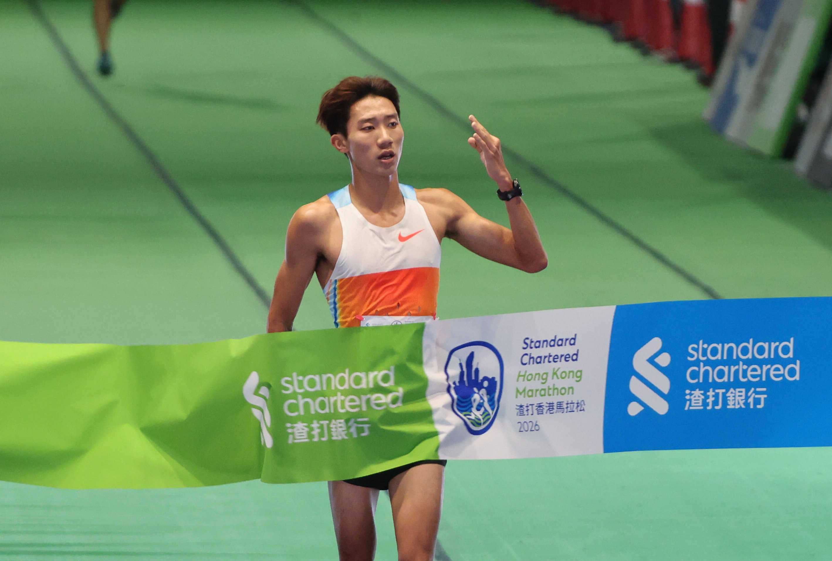 Hong Kong triathlete Wong Tsz-to reaches the 10km finish line first at Victoria Harbour Park. Photo: Dickson Lee