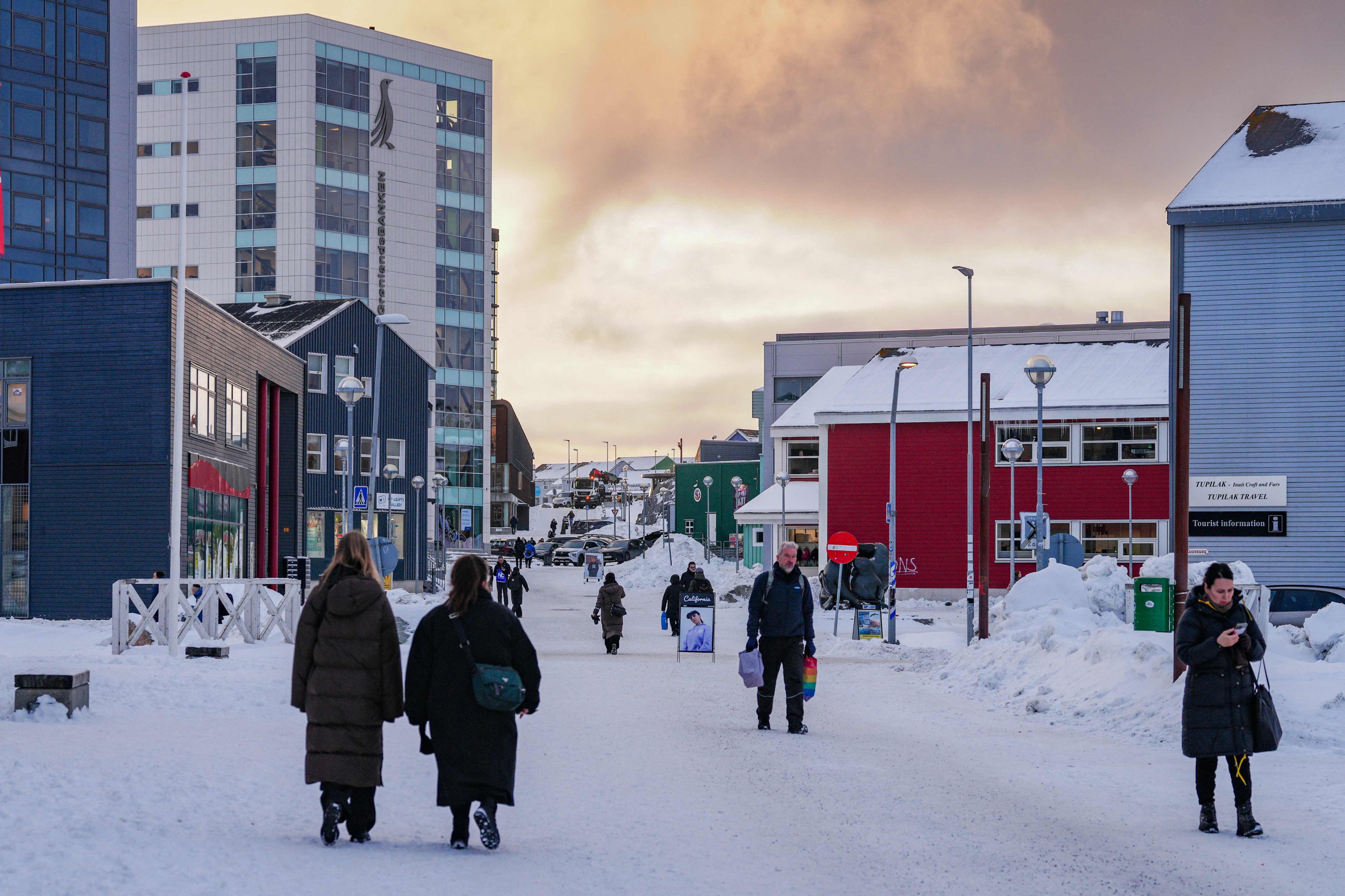 Residents walk along the main shopping street in Nuuk, Greenland, on Thursday. Photo: AFP