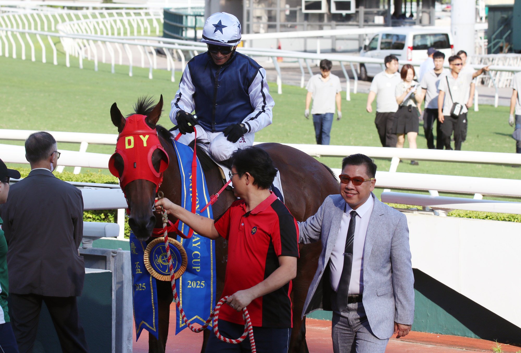 Trainer Dennis Yip with Fast Network after his National Day Cup triumph.