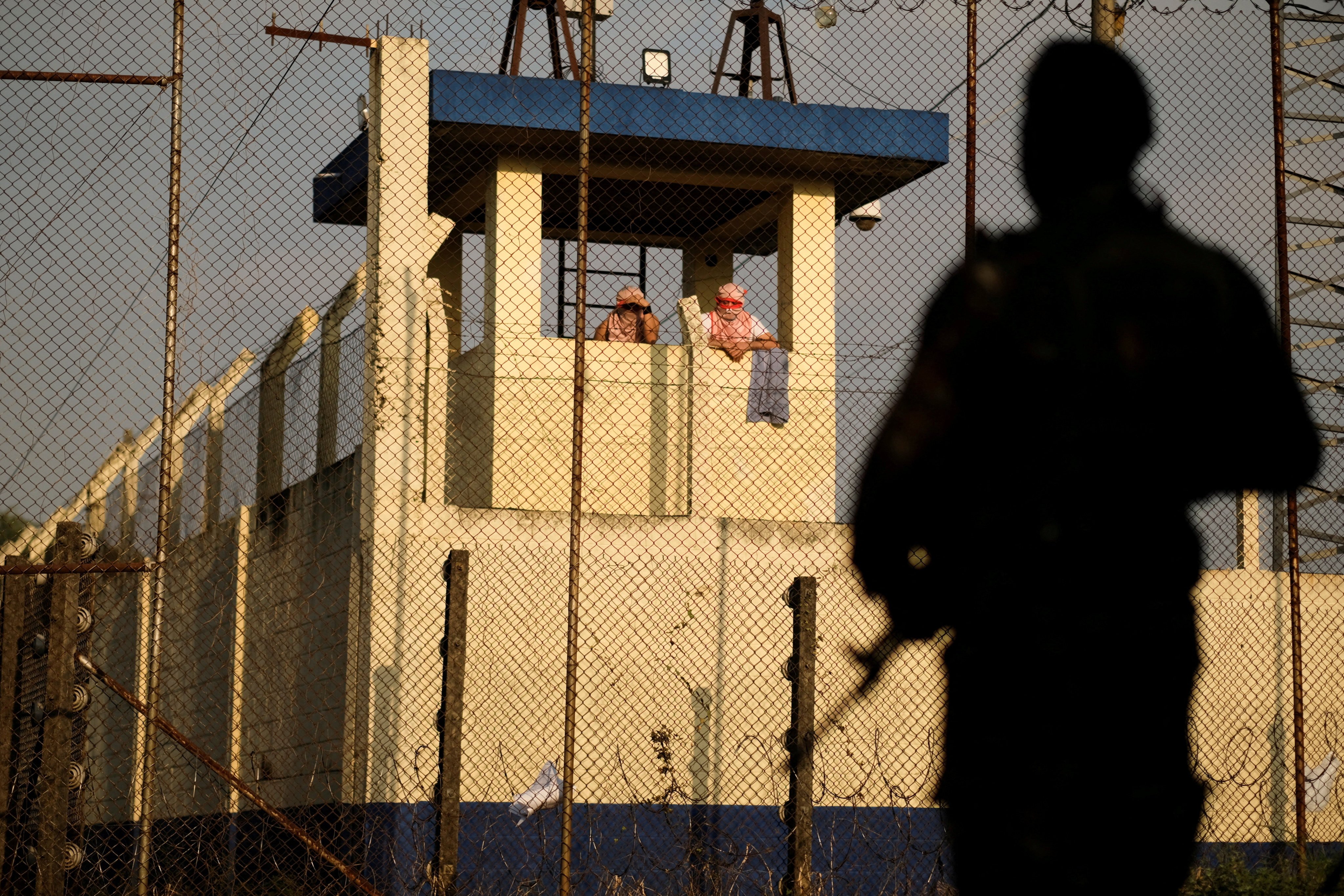 Inmates gather at a watch tower a Renovacion 1 prison as riots erupt in three Guatemalan prisons, with hostages taken, authorities said on Saturday. Photo: Reuters
