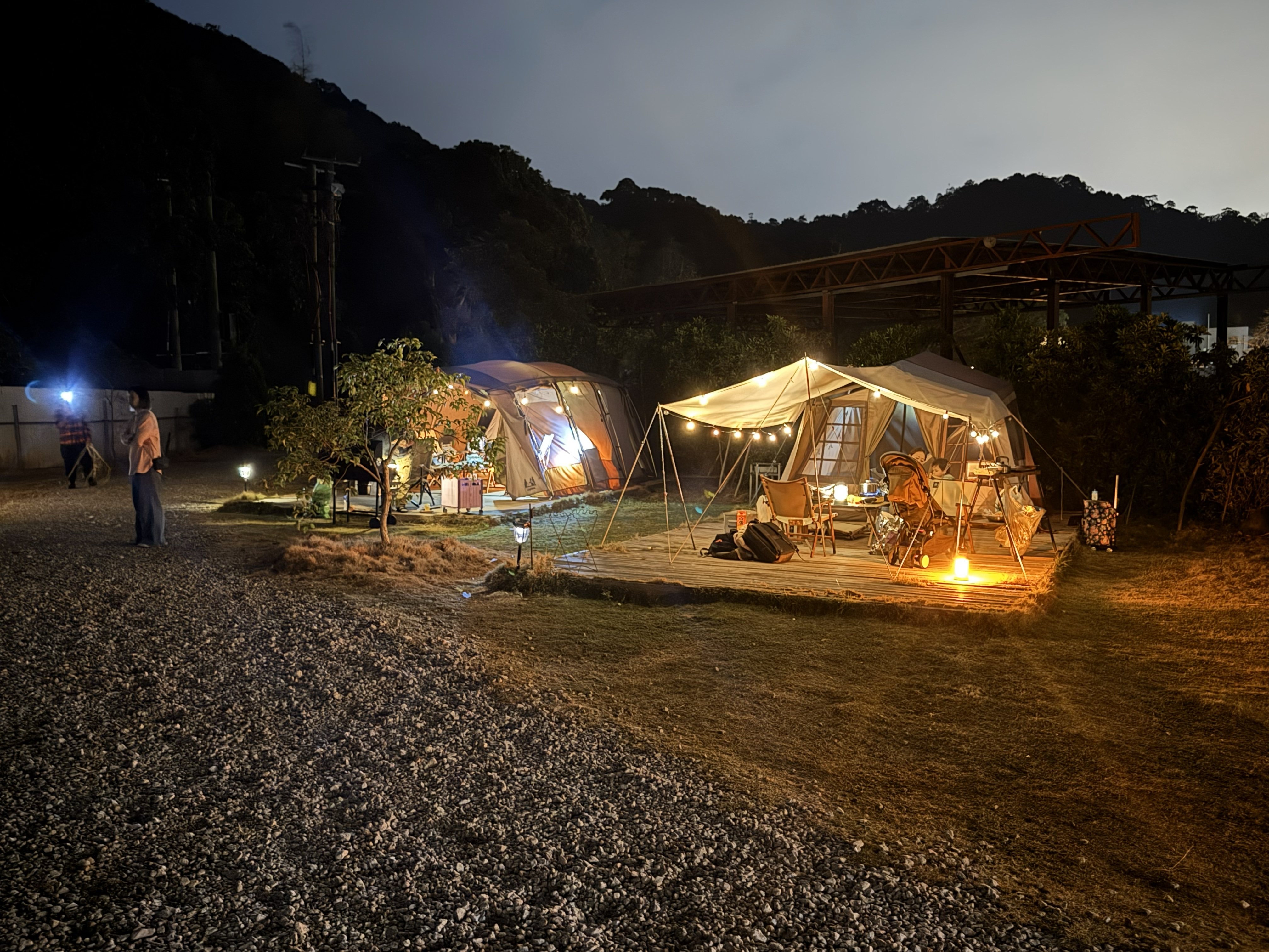 Tents and twinkly lights at the glampsite in Sha Tau Kok as the sun goes down.