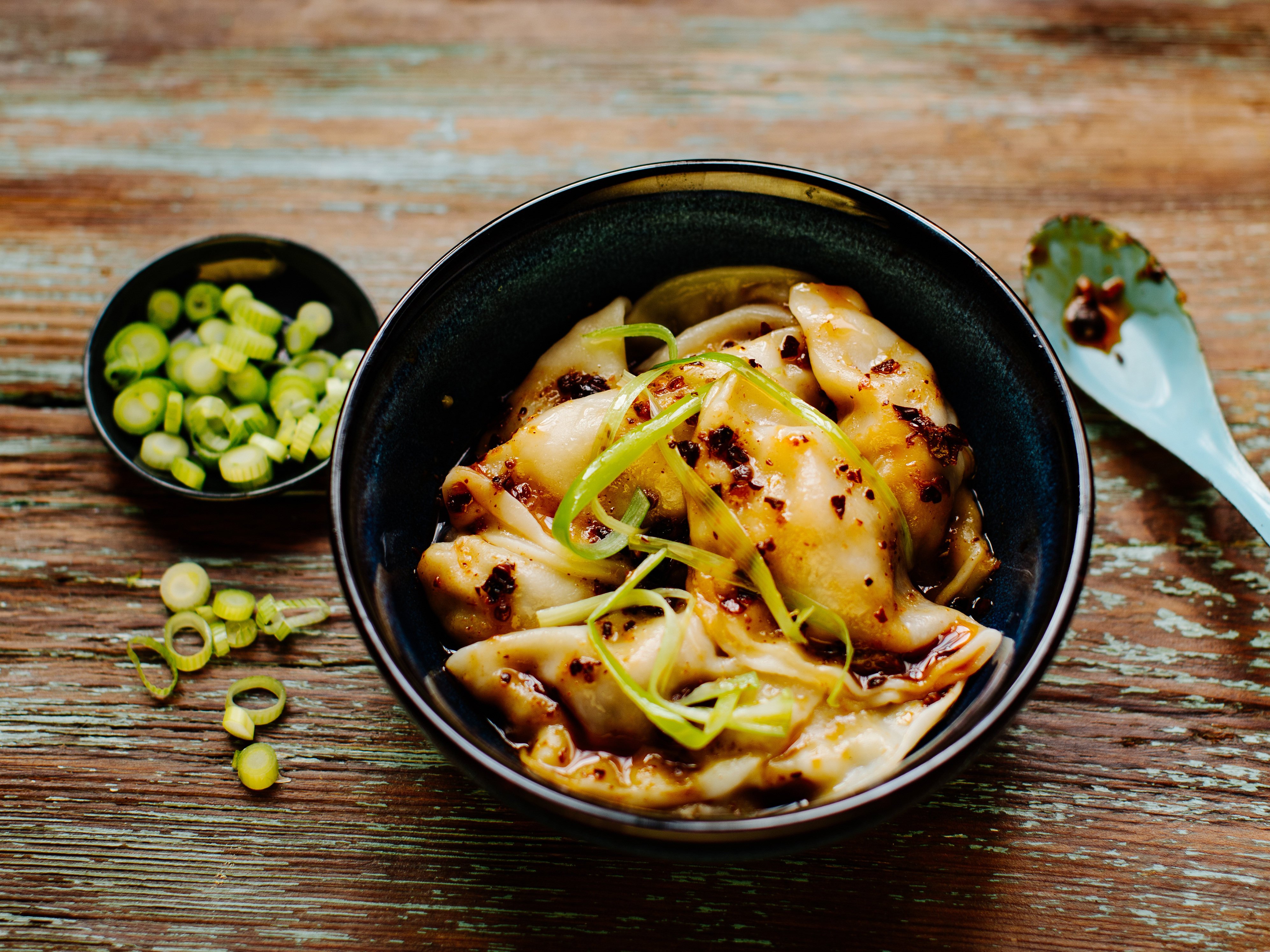 FILED - Wantan, Chinese filled dumplings, here served with chilli oil. Photo: ---/asiastreetfood.com/dpa-tmn - ATTENTION: editorial use only in connection with the aforementioned text and only if the credit mentioned above is referenced in full