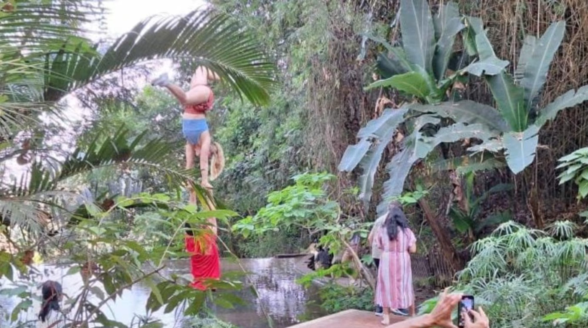 A couple, left of centre, perform acro-yoga at the ancient site in Chiang Mai. Photo: Thaiger