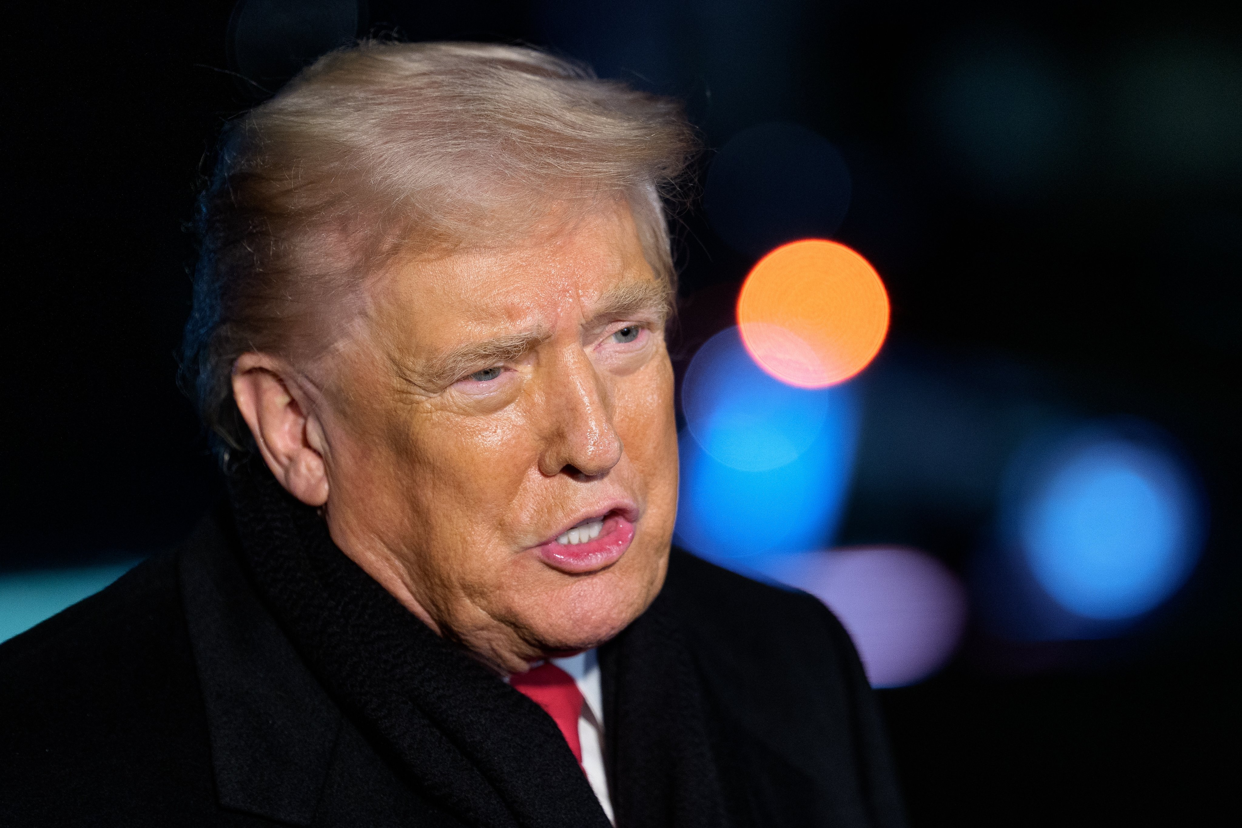 US President Donald Trump speaks to the media on the South Lawn of the White House on Monday. Photo: EPA