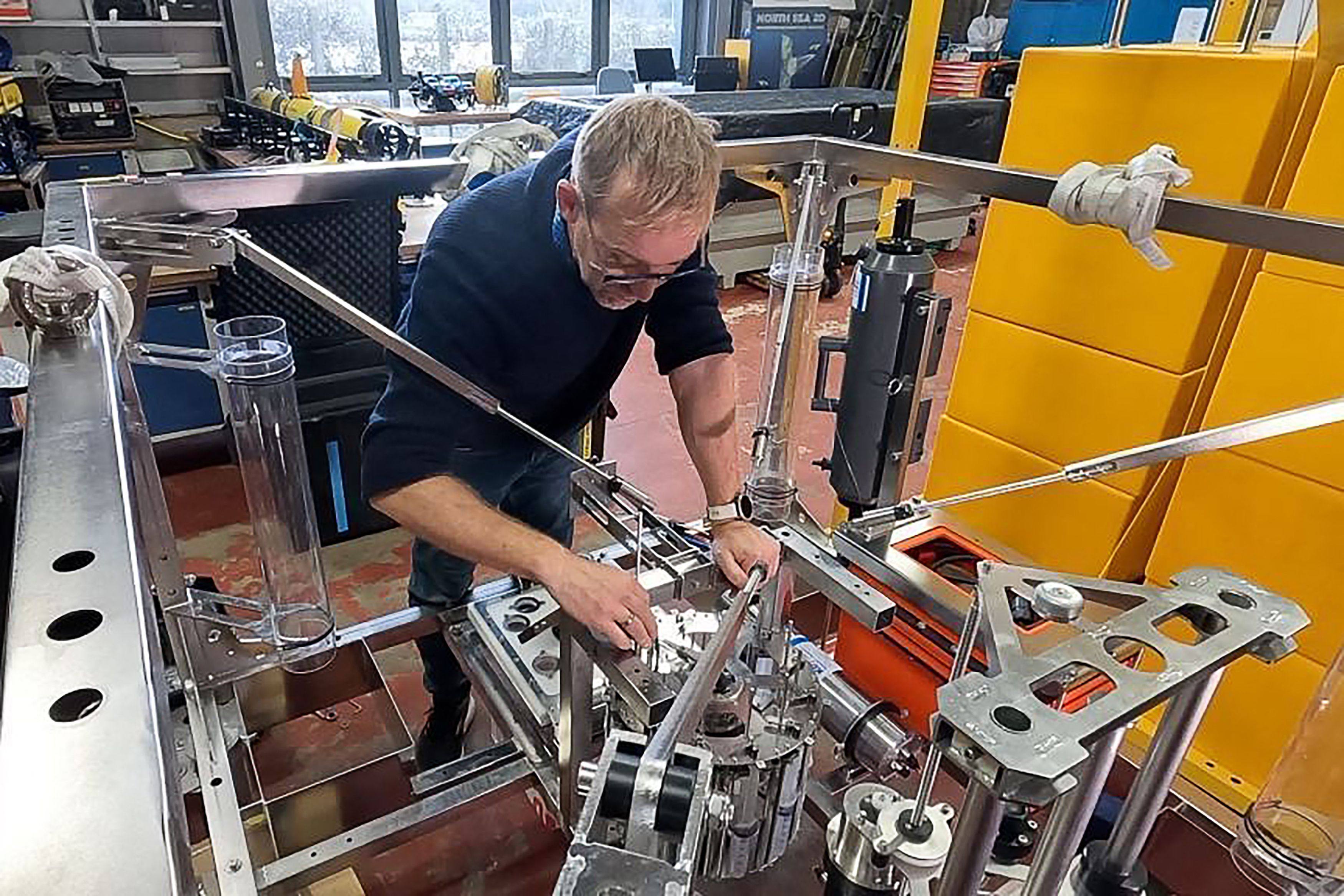 Andrew Sweetman is seen in an undated image working with one of the new landers in Oban, Scotland. Photo: Scottish Association for Marine Science of AFP