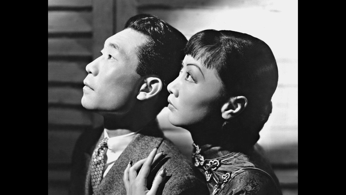 Philip Ahn (left) and Anna May Wong in a still from Daughter of Shanghai (1937). The pair’s romance in the film made them the era’s first Asian-American couple portrayed by Asian-American actors.