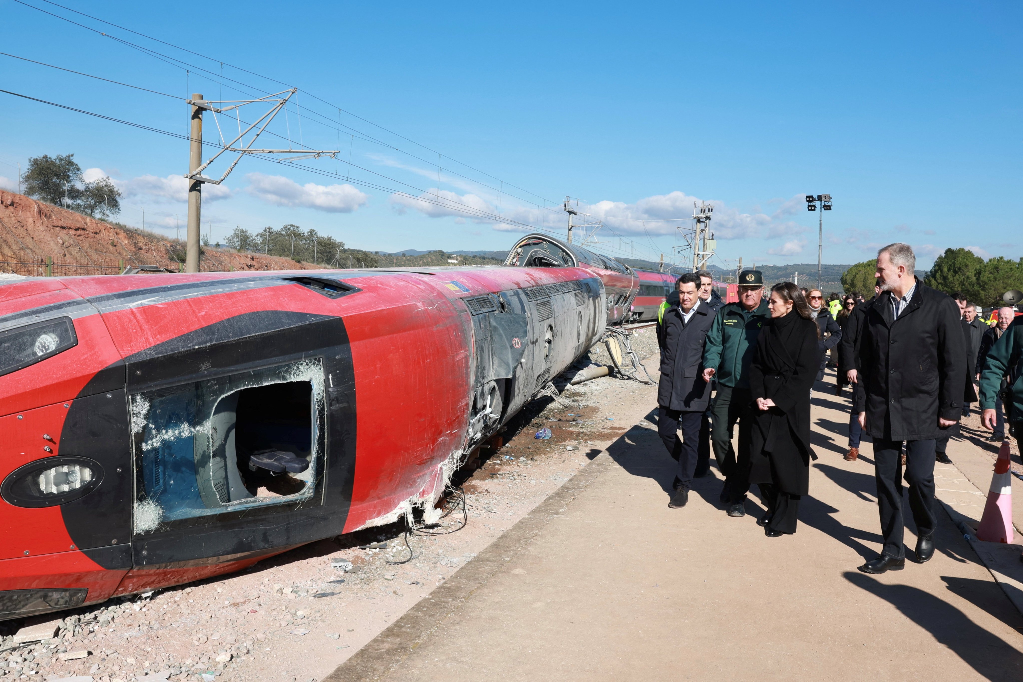 Spain’s King Felipe and Queen Letizia visit the site of the deadly derailment of two high-speed trains near Adamuz, in Cordoba, Spain, on Tuesday. Photo: Reuters