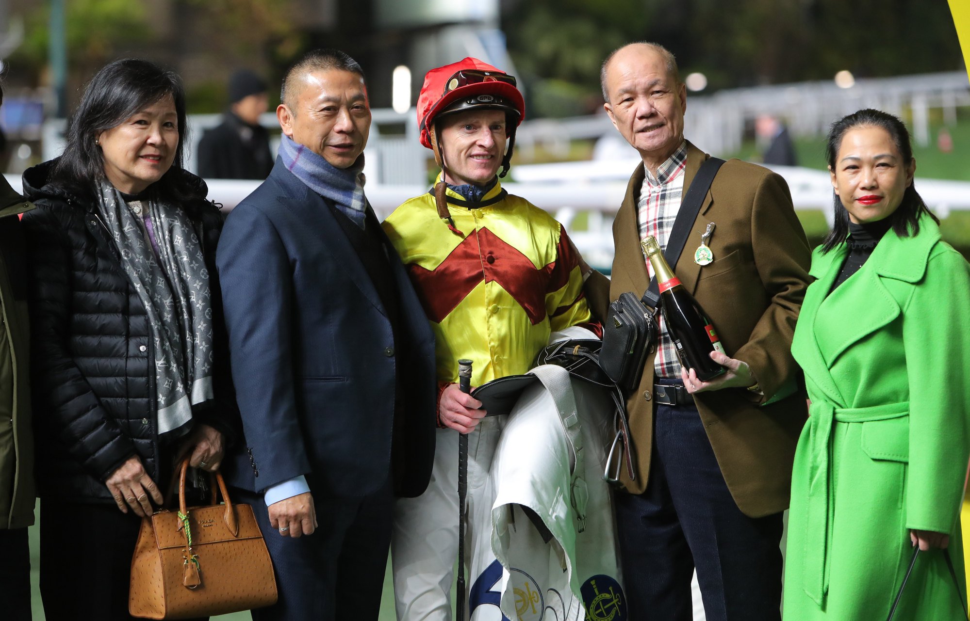 Trainer Danny Shum (second left) and jockey Zac Purton. Trainer Danny Shum (second left) and jockey Zac Purton.