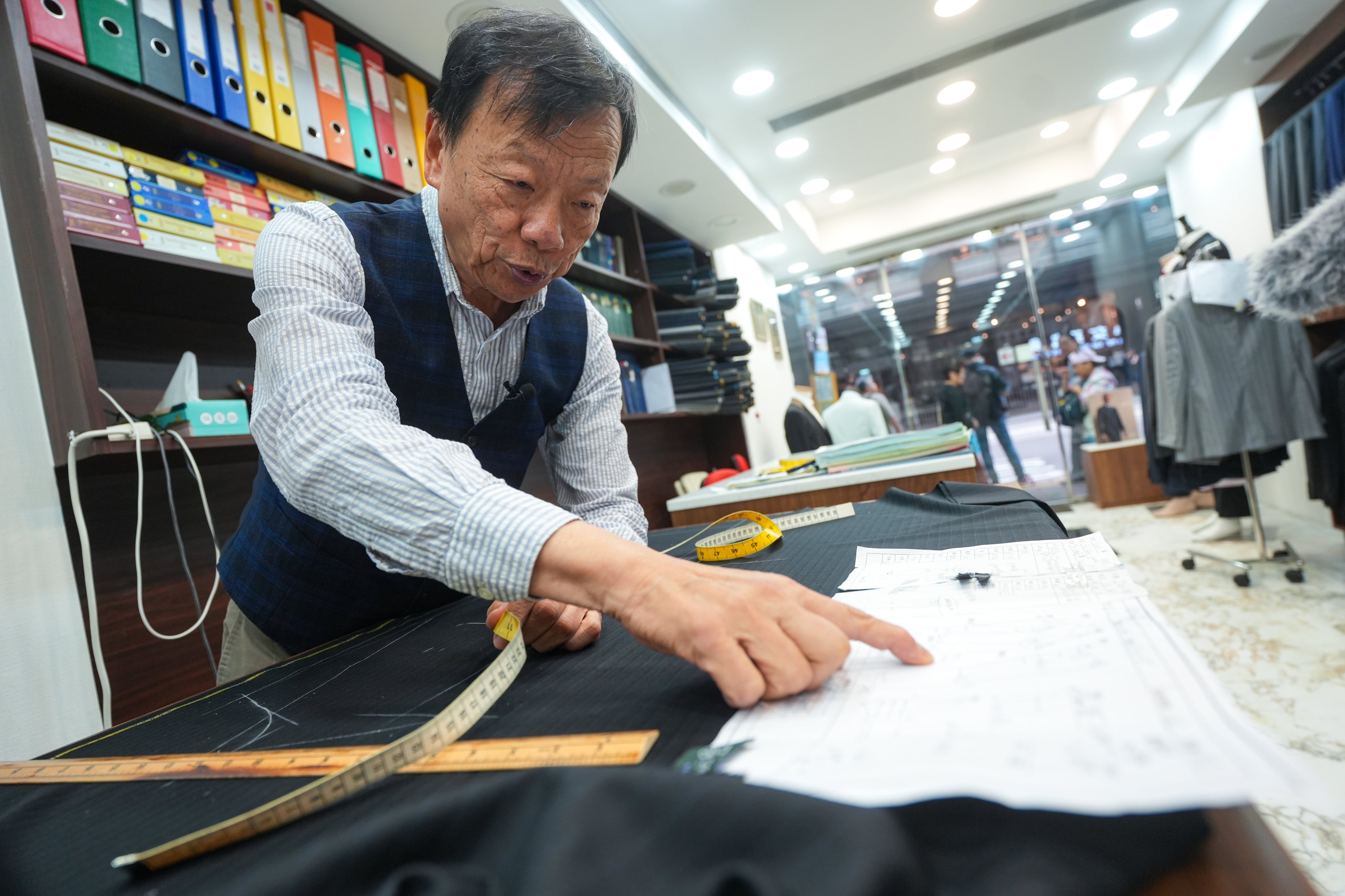 Master Woo, tailor and owner of Benny Woo Sartorial, at his shop in Central. Photo: Sun Yeung
