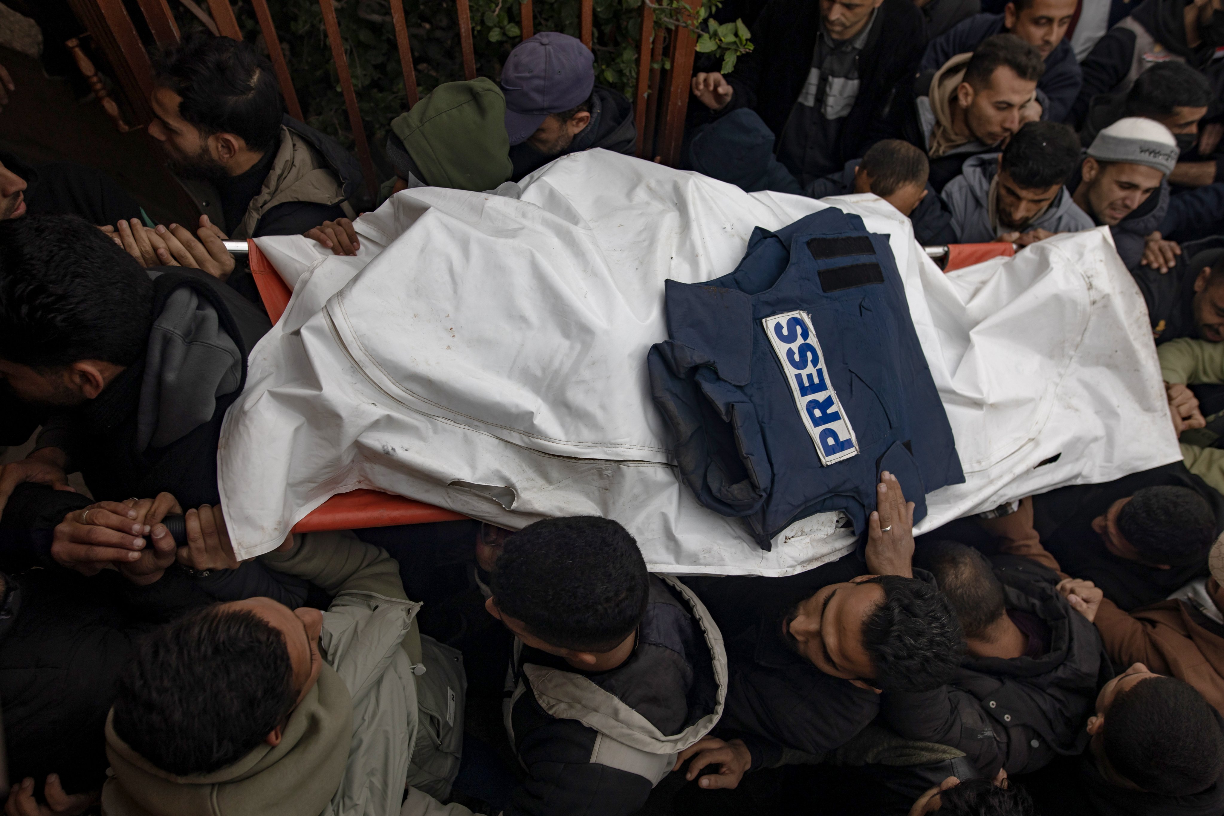 Mourners carry the bodies of three journalists through Nasser Hospital in Khan Yunis, southern Gaza Strip on Wednesday. Photo:  EPA