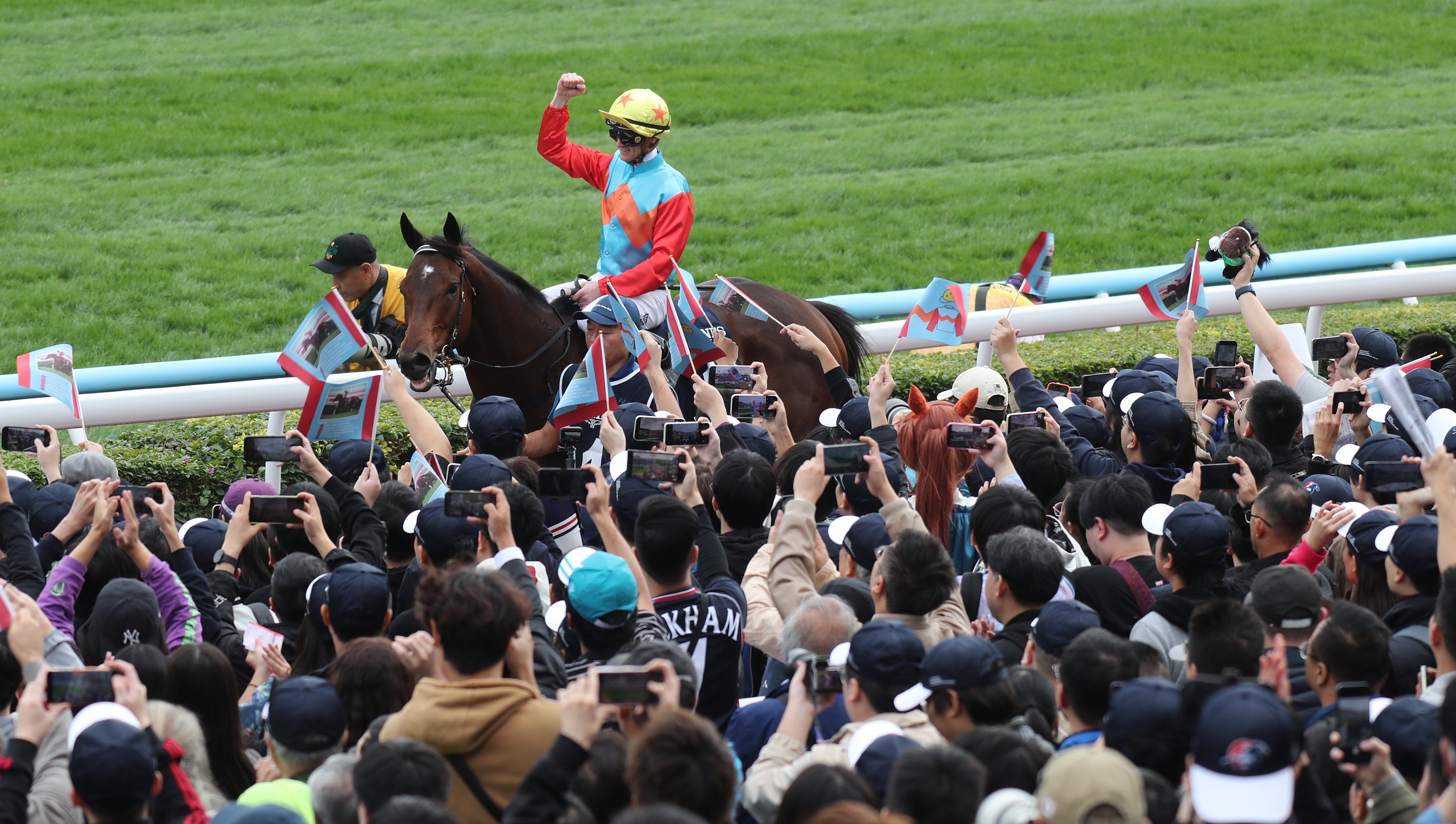 Jockey Zac Purton celebrates Ka Ying Rising’s Hong Kong Sprint success with fans at Sha Tin. Photos: Kenneth Chan