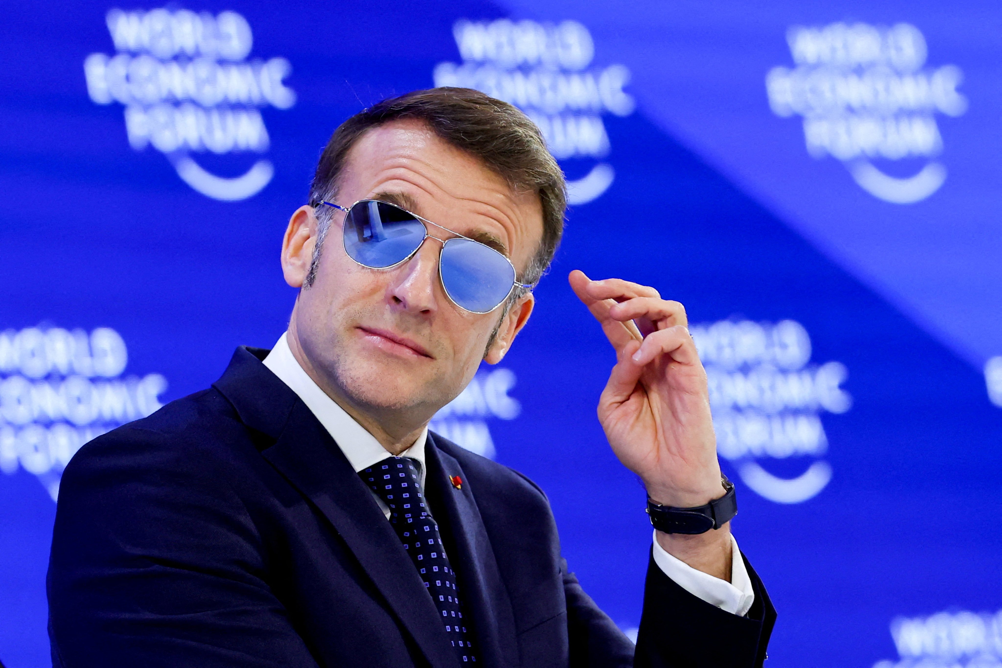 France’s President Emmanuel Macron wears sunglasses as he attends the World Economic Forum meeting in Davos, Switzerland, on Tuesday. Photo: Reuters