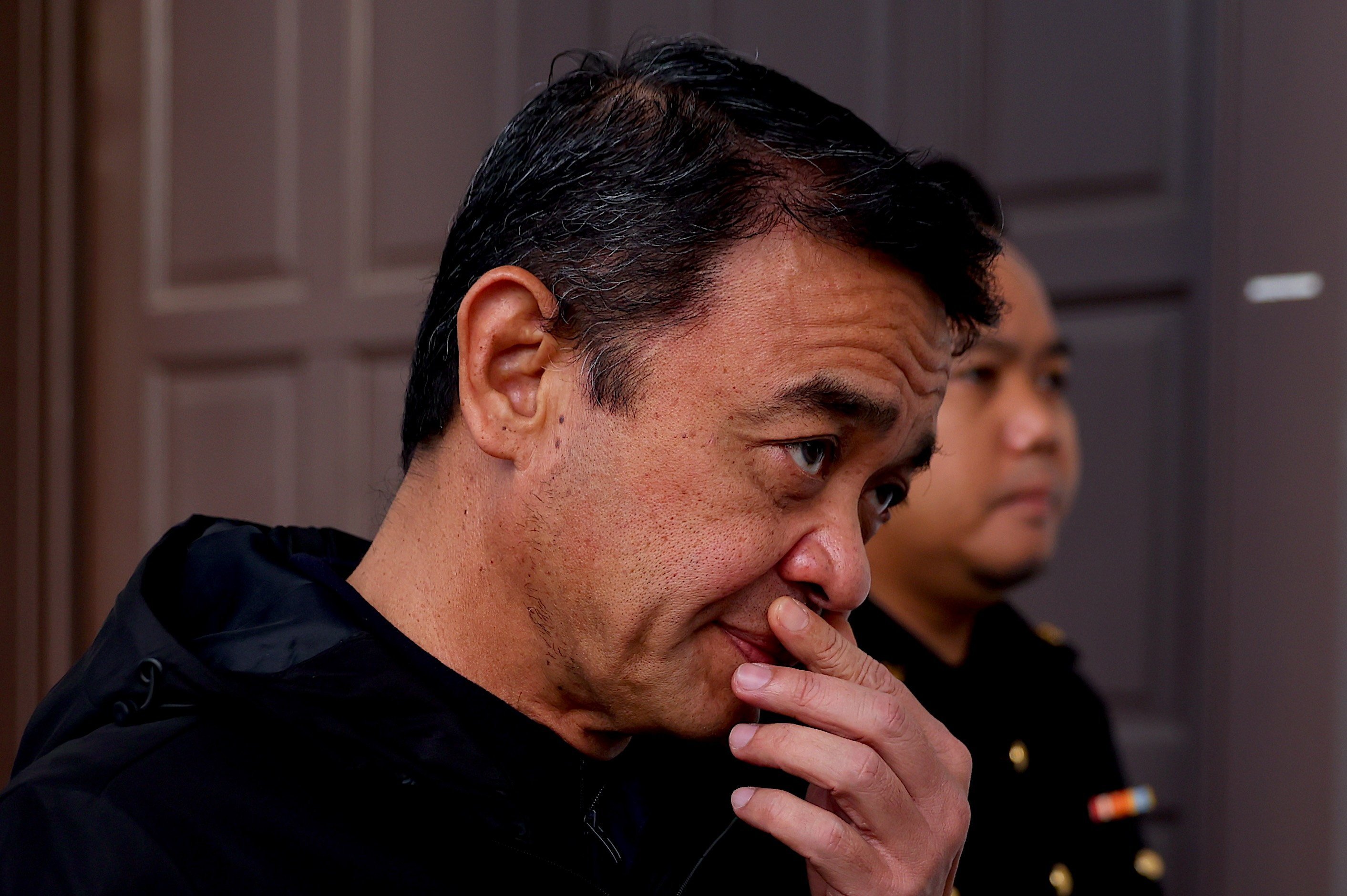 Former Malaysian army chief Muhammad Hafizuddeain Jantan is escorted to court on Thursday. Photo: EPA