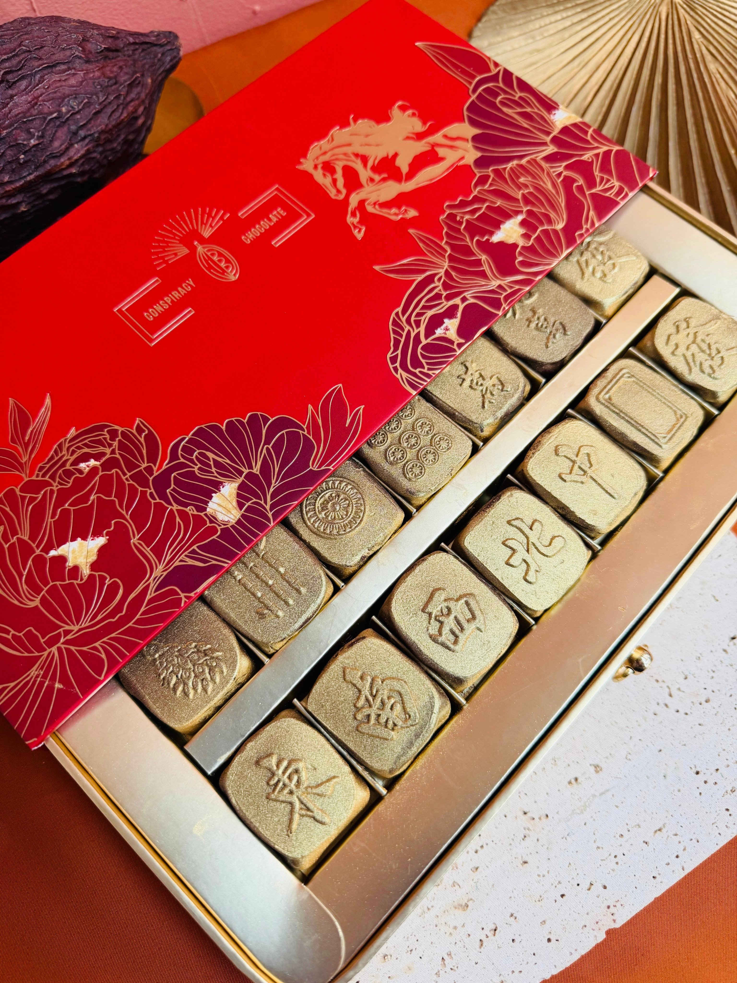 A box of Conspiracy Chocolate’s latest Lunar New Year collection showcases “mahjong tiles” displayed in a winning “13 Orphans” hand. The chocolate set has sparked a cultural appropriation debate over its unlucky symbolism. Photo: Conspiracy Chocolate