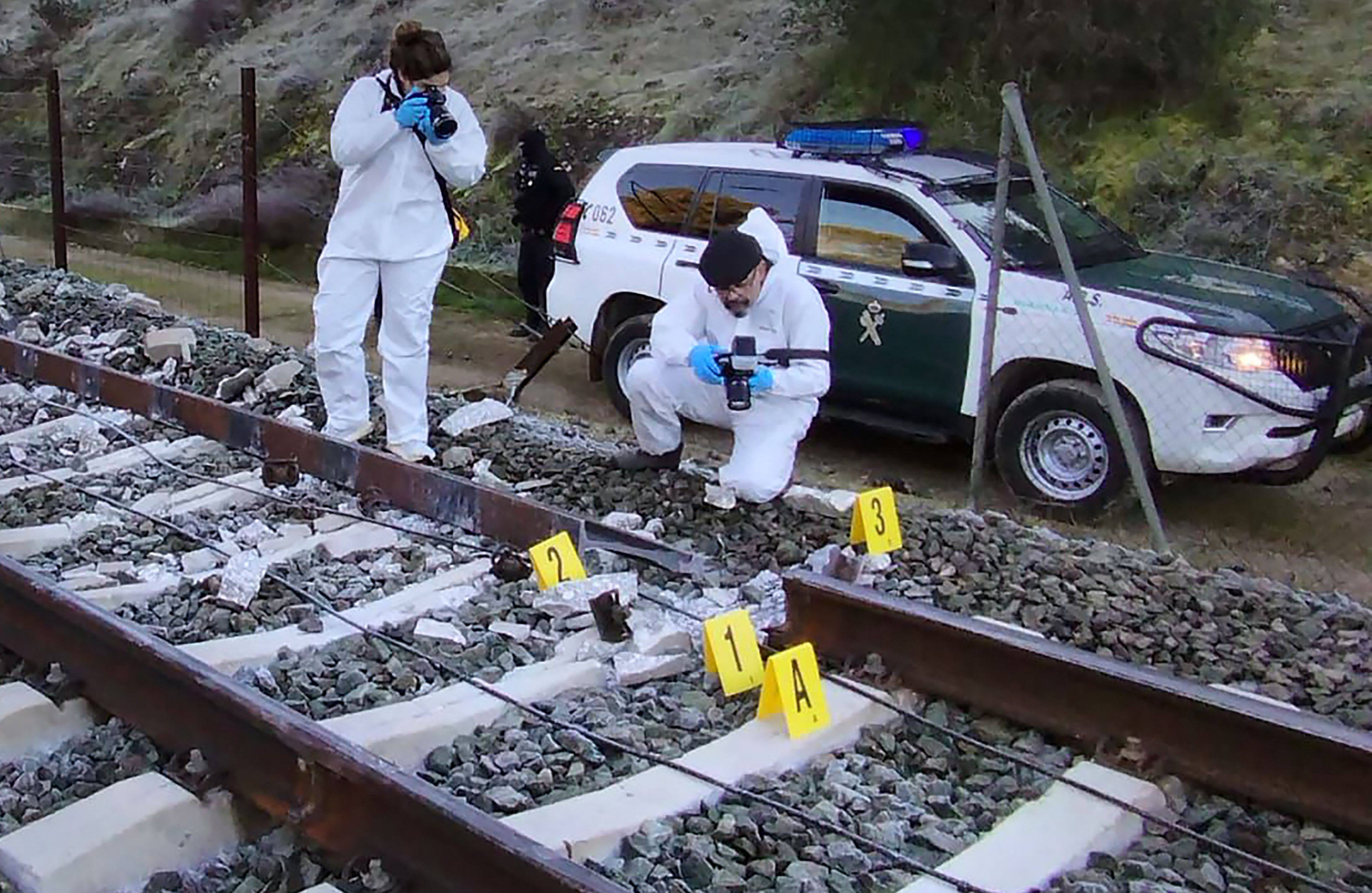 Civil agents working at the site where a high-speed Iryo train derailed and hit another train in Adamuz, Spain on Monday. Photo: Guardia Civil/AFP