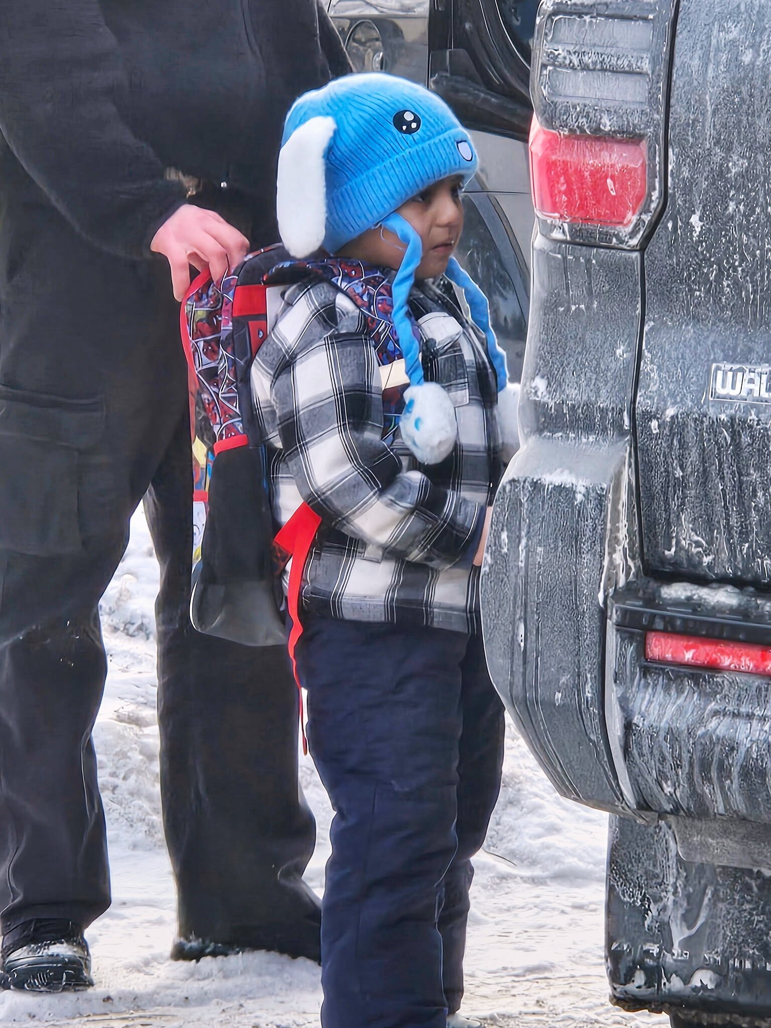 Liam Conejo Ramos, 5, is detained by ICE officers after arriving home from school on Tuesday. Photo: AP