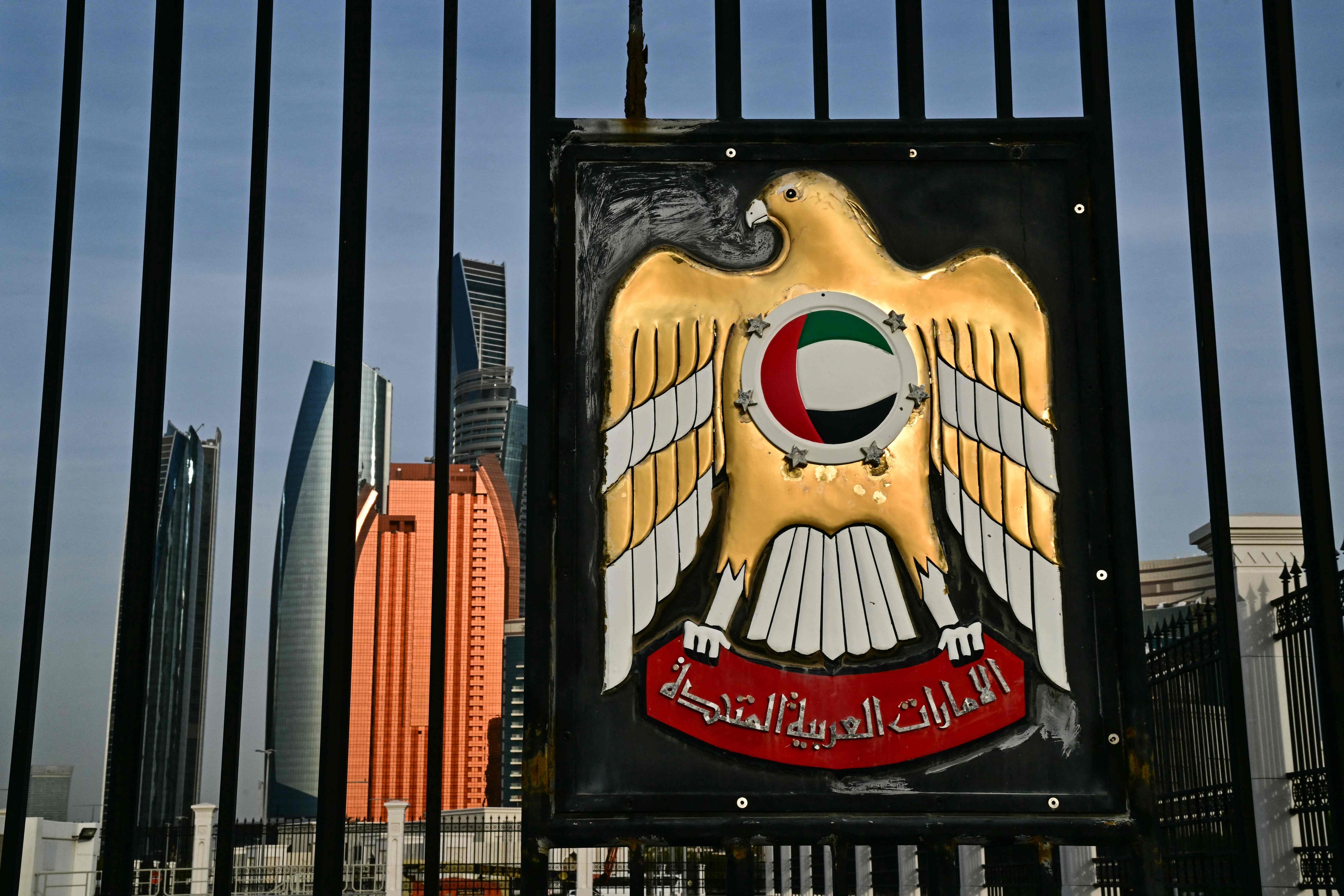 The emblem of the United Arab Emirates is seen on the fence of the Qasr al-Watan presidential palace in Abu Dhabi on Friday. Photo: AFP