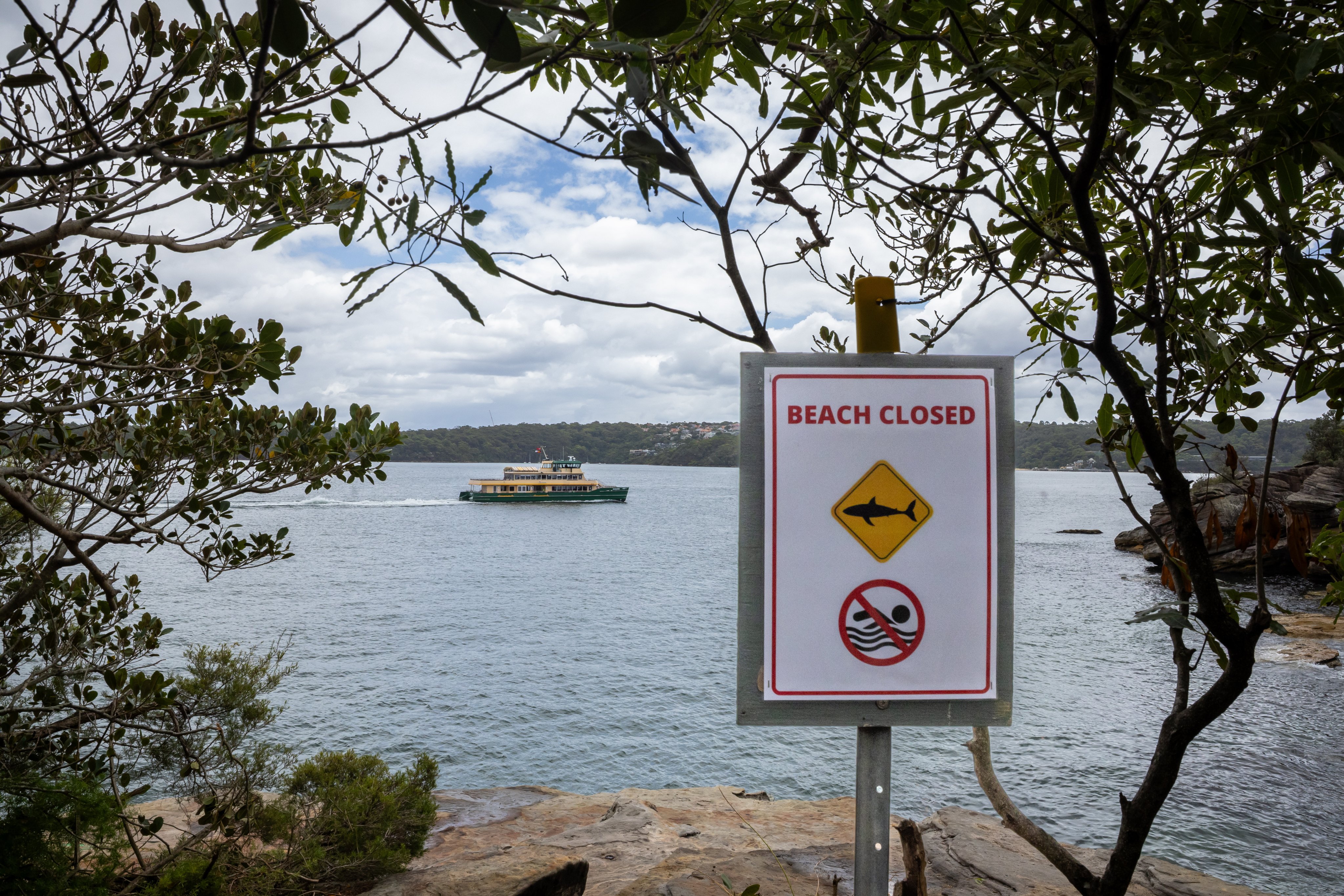 Authorities close a popular rock jumping point near Shark Beach in Vaucluse, Sydney, after a 12-year-old biy is attacked by a shark on Sunday. Photo: EPA