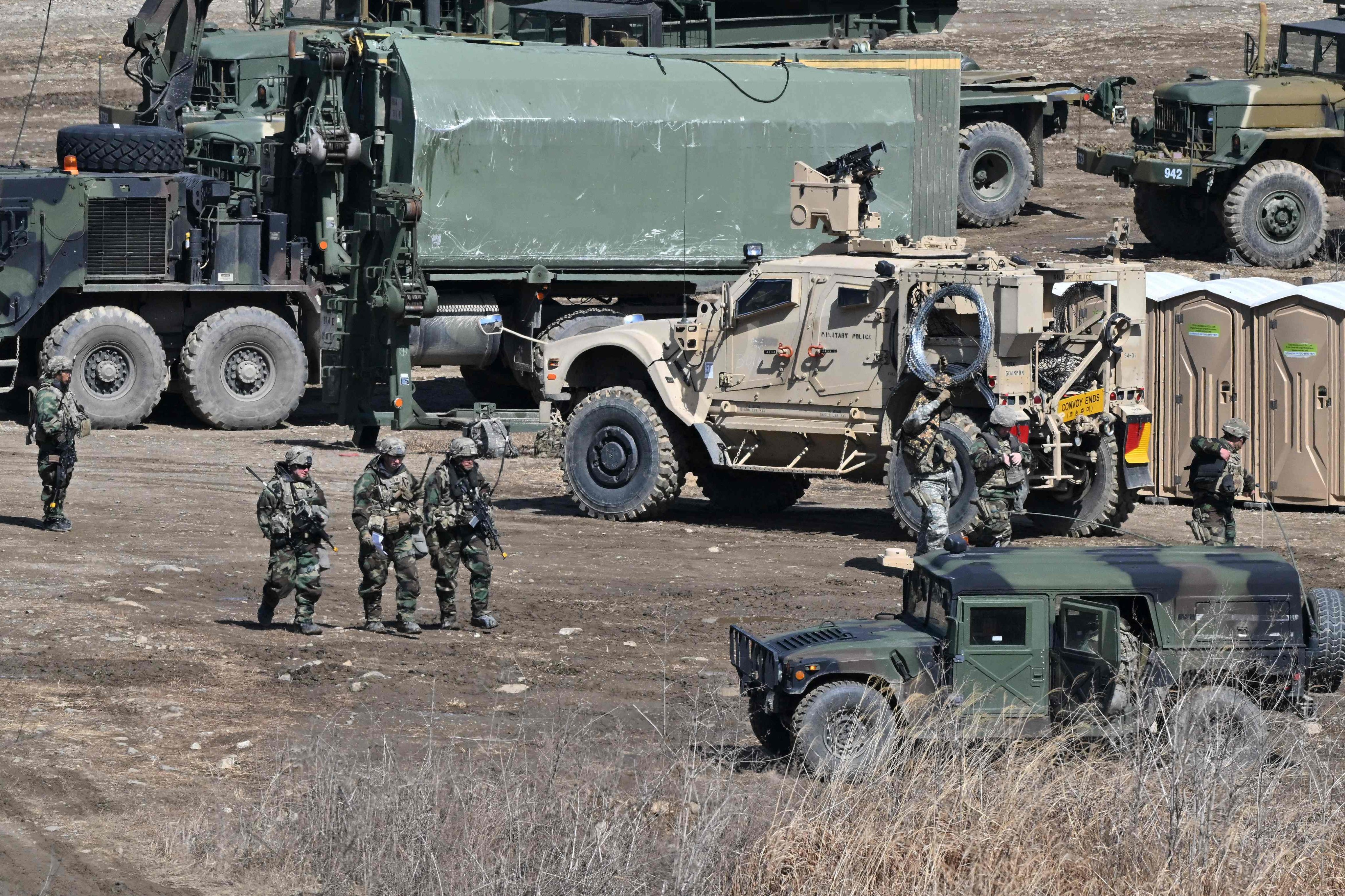 US soldiers walk past military vehicles at a military training field in the border city of Yeoncheon, South Korea, in 2023. Photo: AFP