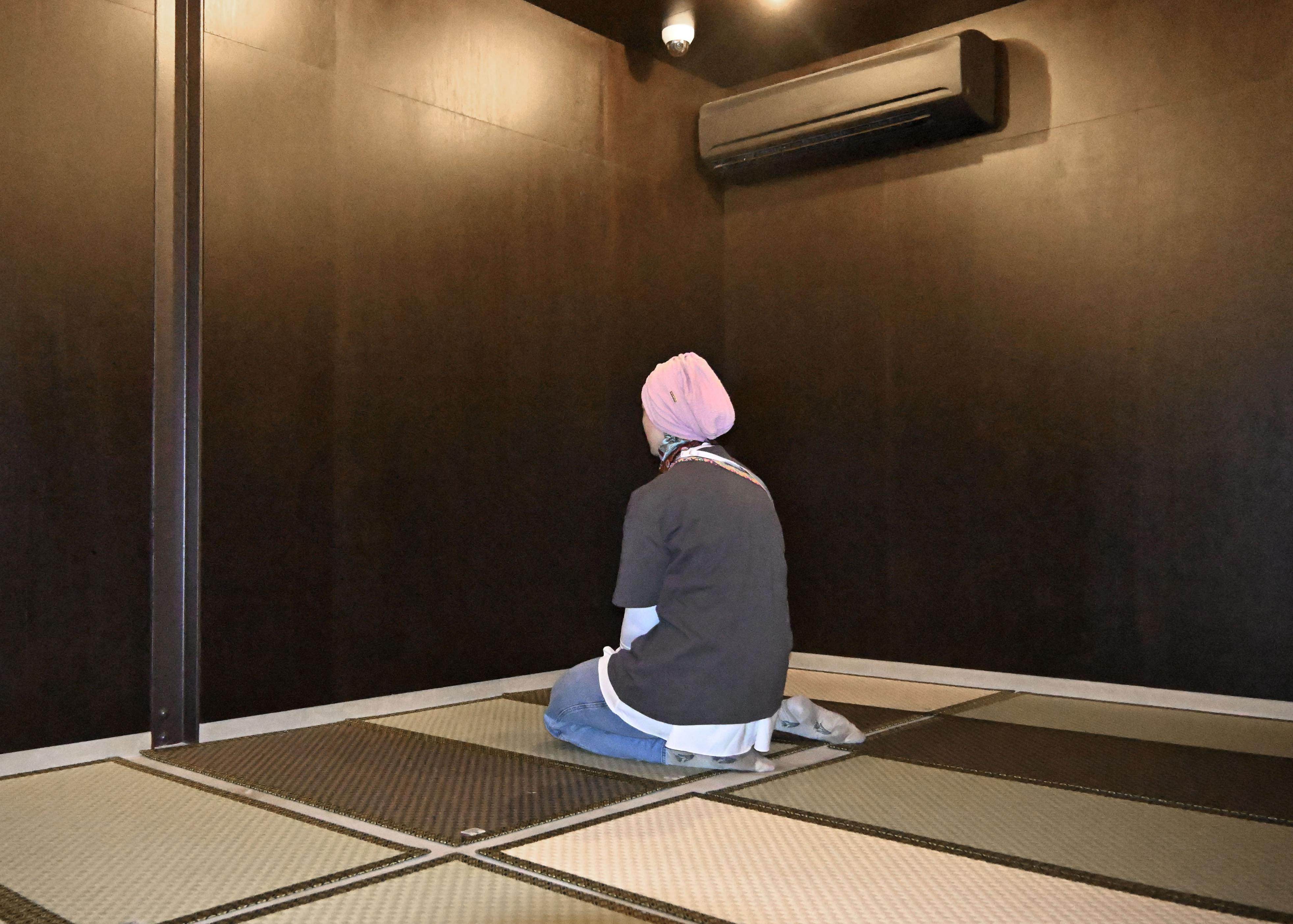 A Muslim woman prays in the prayer room at the World Exposition in Osaka, Japan, last year. Photo: Kyodo