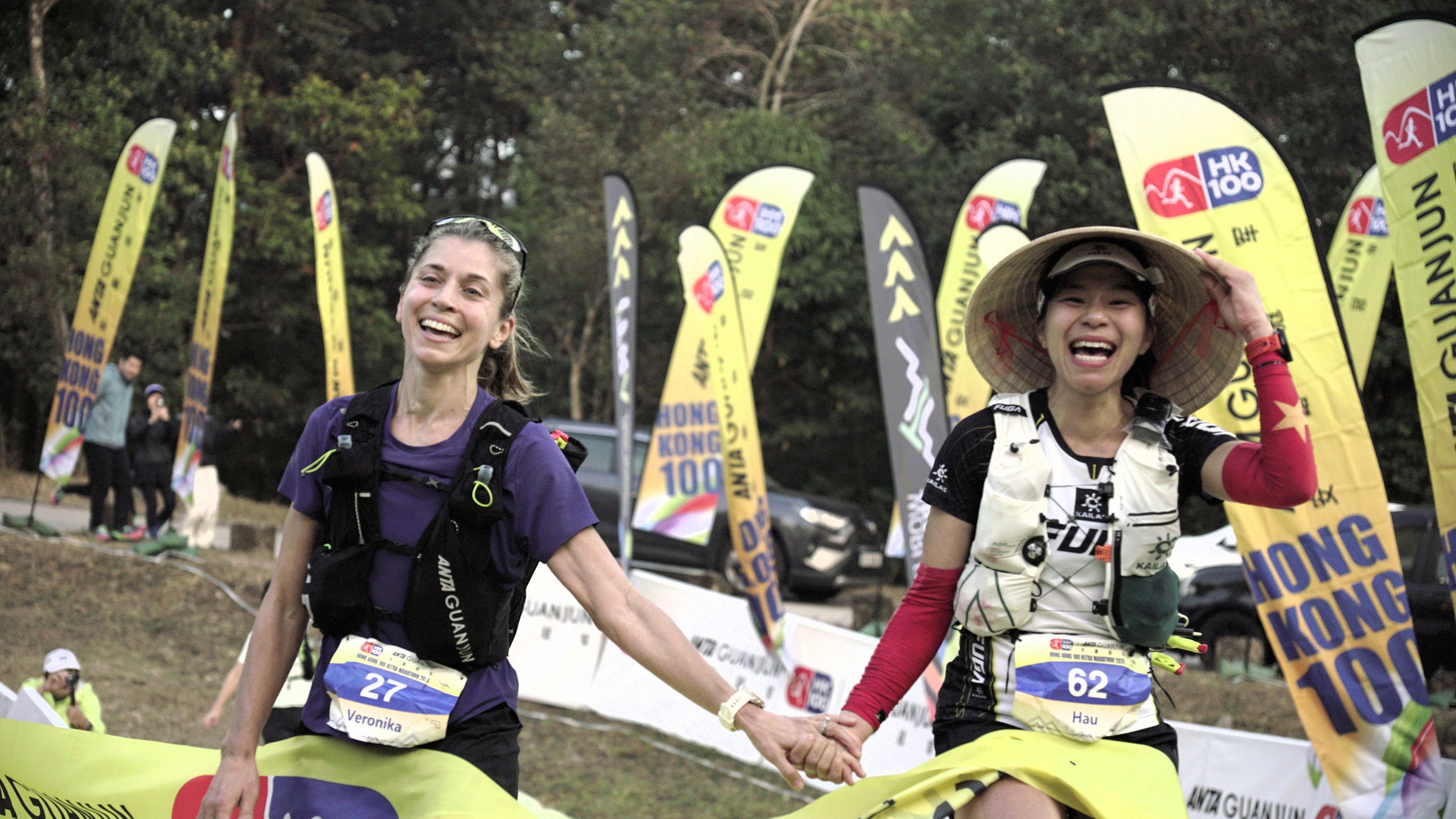 Slovakian Veronika Leng (left) and Vietnam’s Hau Ha won Saturday’s Anta Guanjun Hong Kong 100 race while holding hands. Photo: Handout