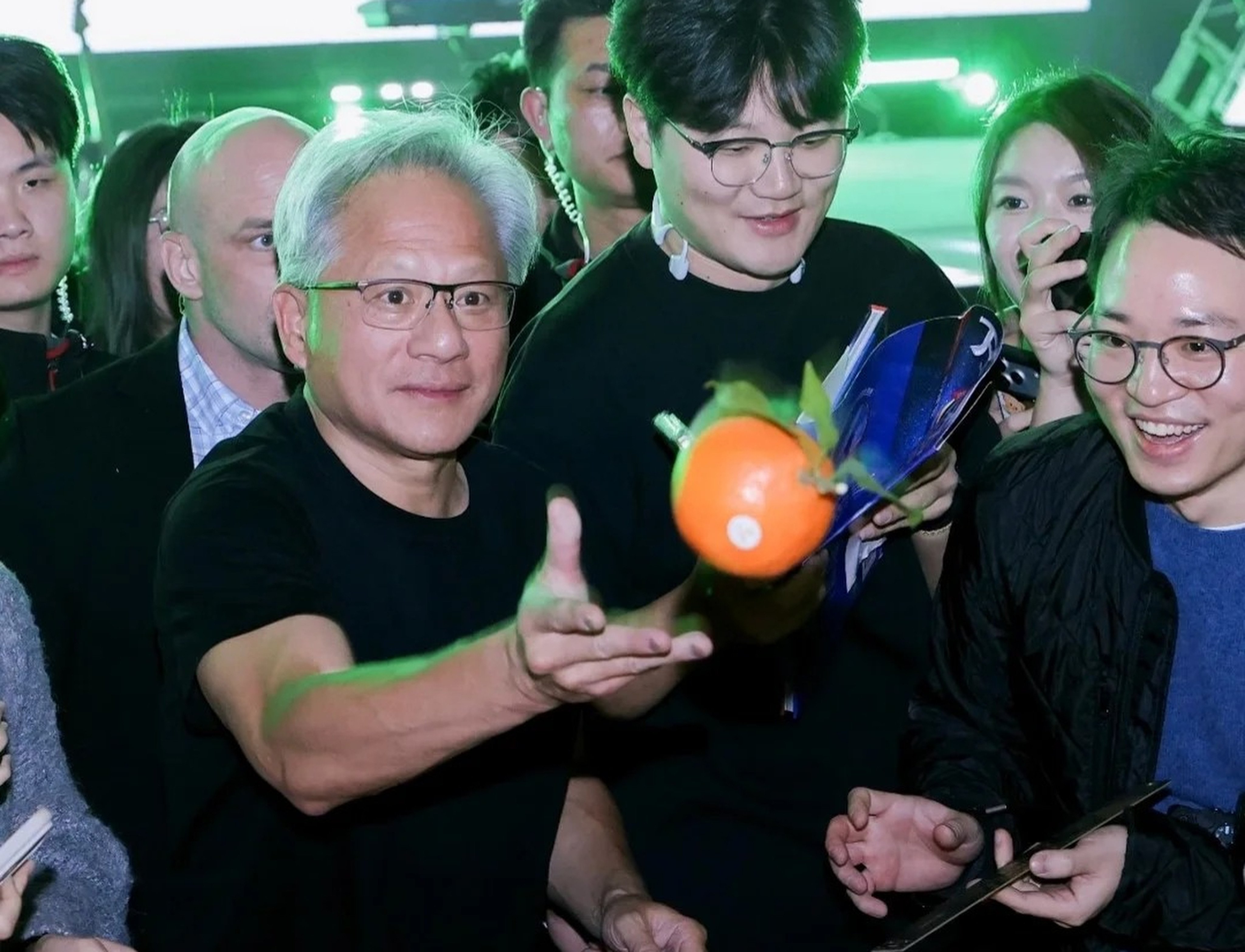 Jensen Huang hands out tangerines at Nvidia’s annual Lunar New Year celebration in Shanghai on January 24, 2026. Photo: Handout