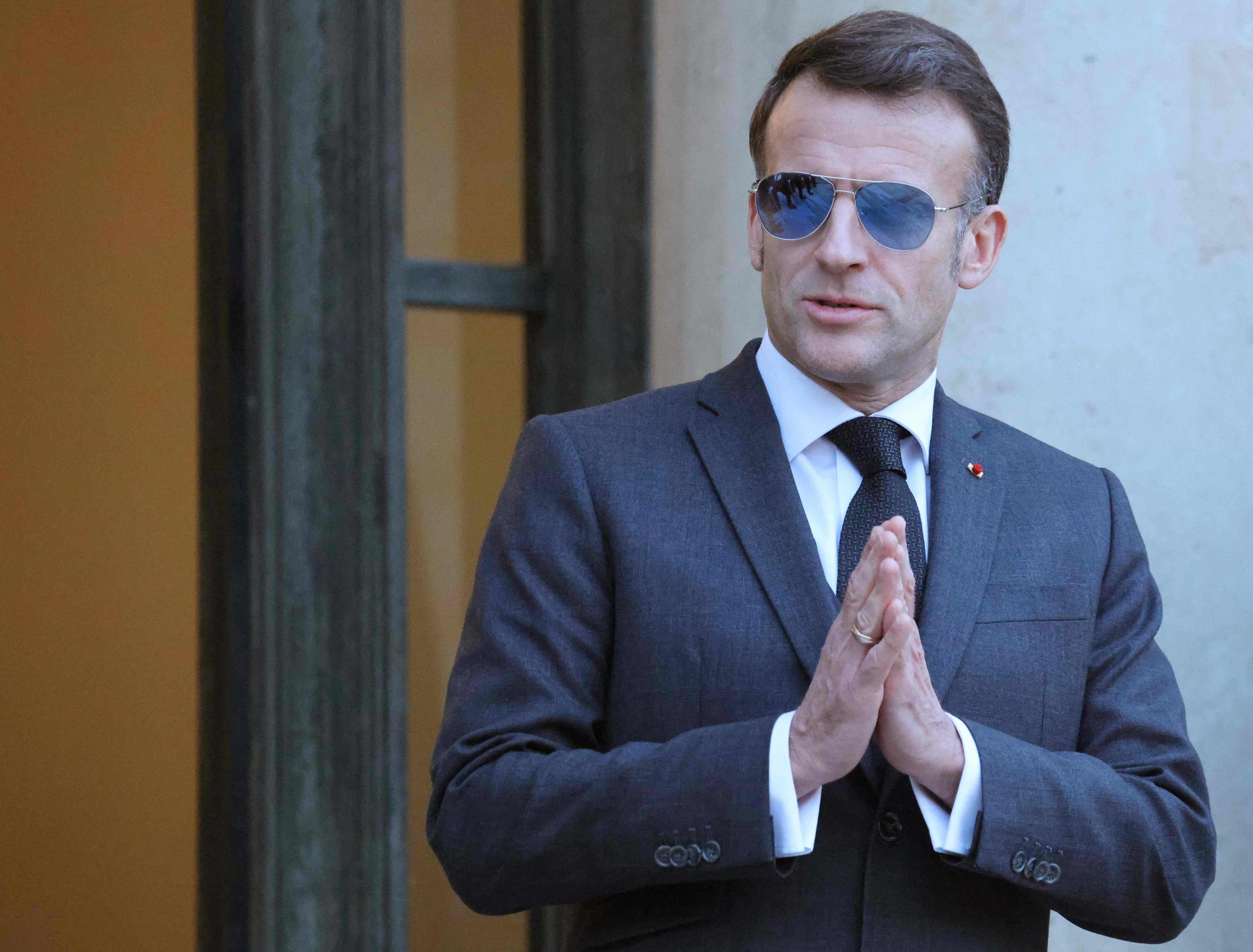 France’s President Emmanuel Macron wearing sunglasses as he waits for Lebanon’s Prime Minister prior to their meeting at the Elysee presidential palace in Paris, on Friday. Photo: AFP
