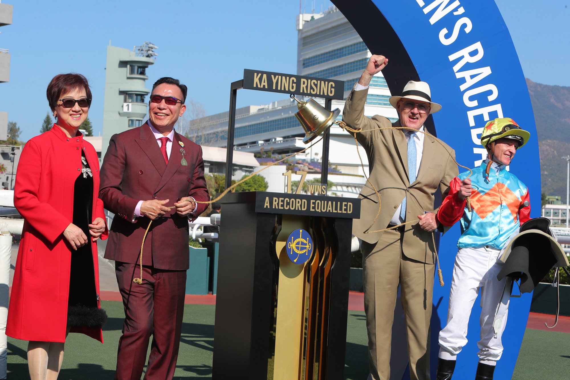 Ka Ying Rising’s connections celebrate his win.