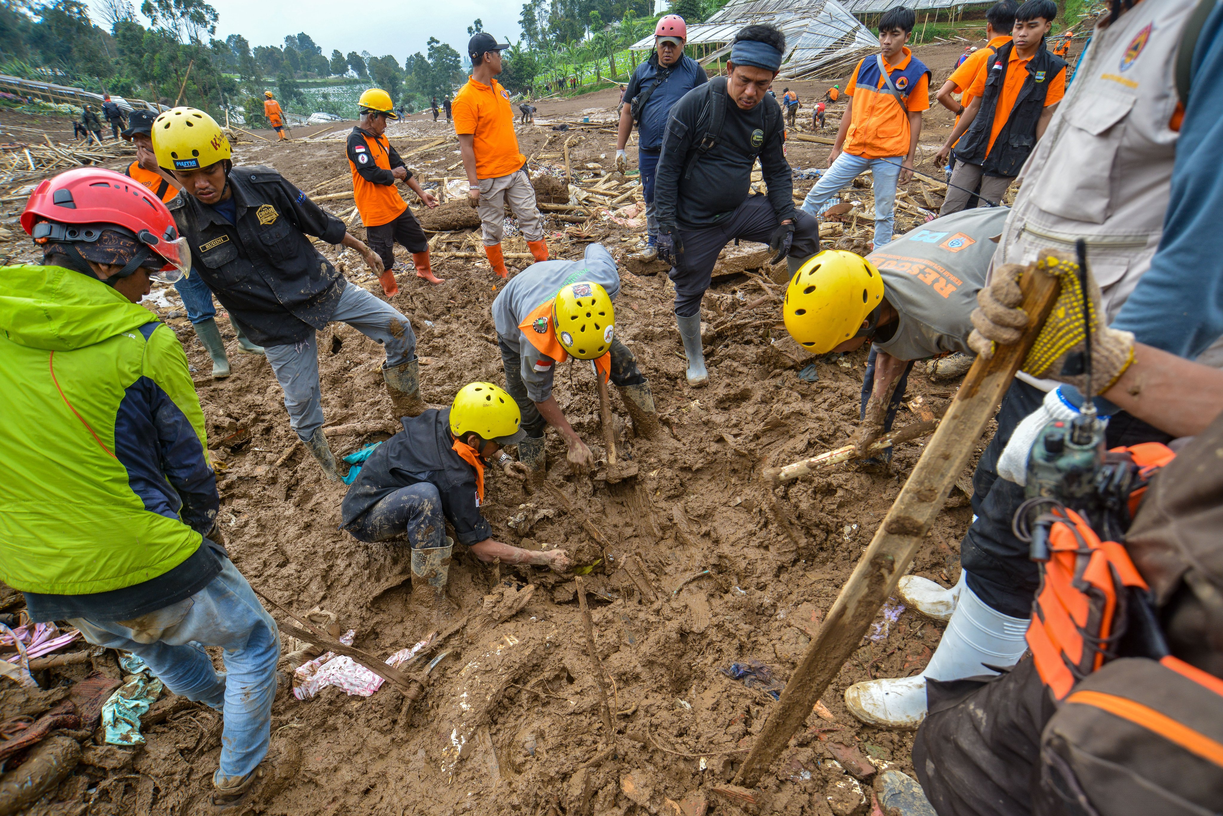 Rescuers search for victims in a landslide-affected area in Pasirlangu village, West Bandung, West Java Province, Indonesia, on Sunday. Photo: EPA-EFE