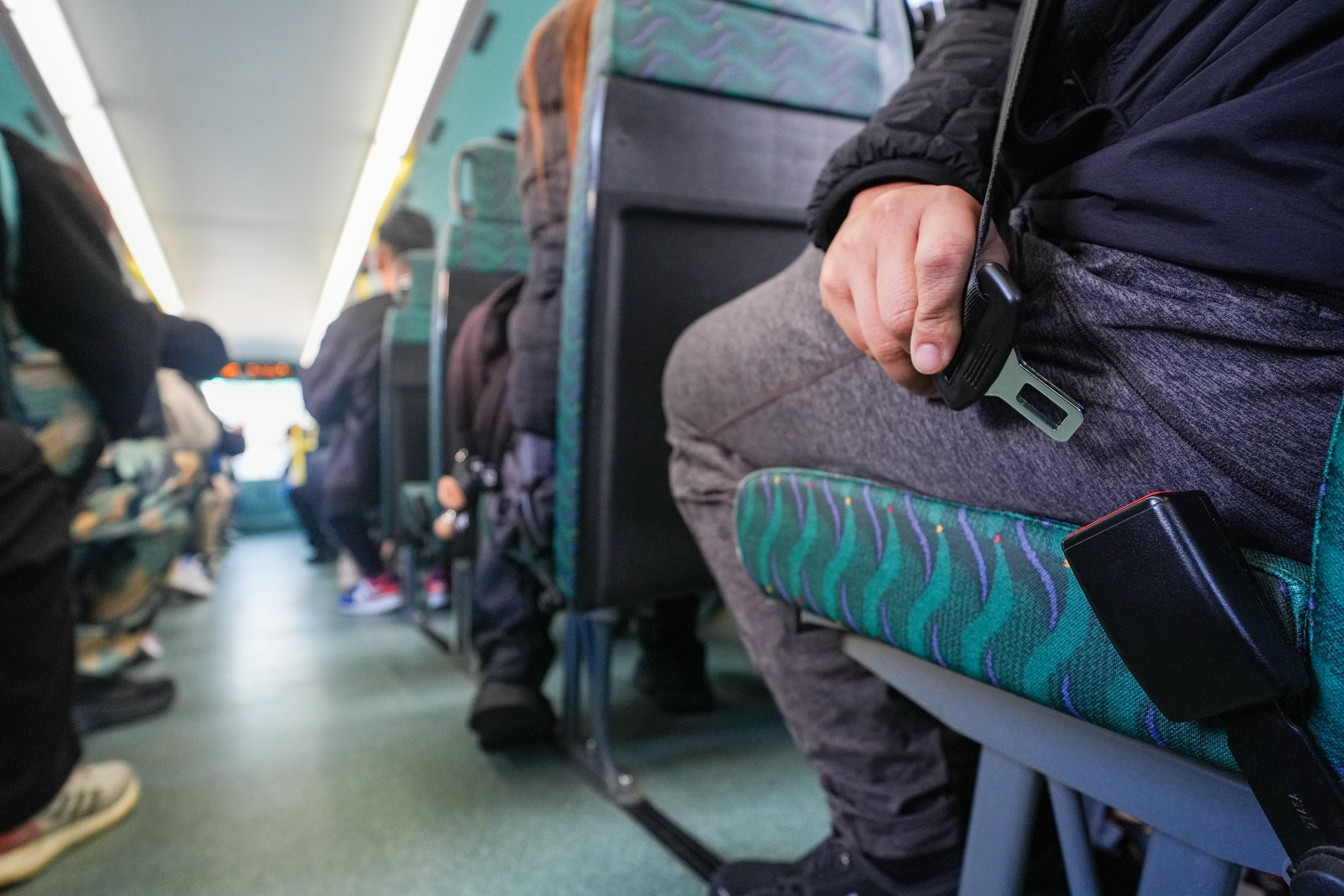 A new law taking effect on Sunday mandates that passengers must wear seat belts on buses. Photo: Eugene Lee