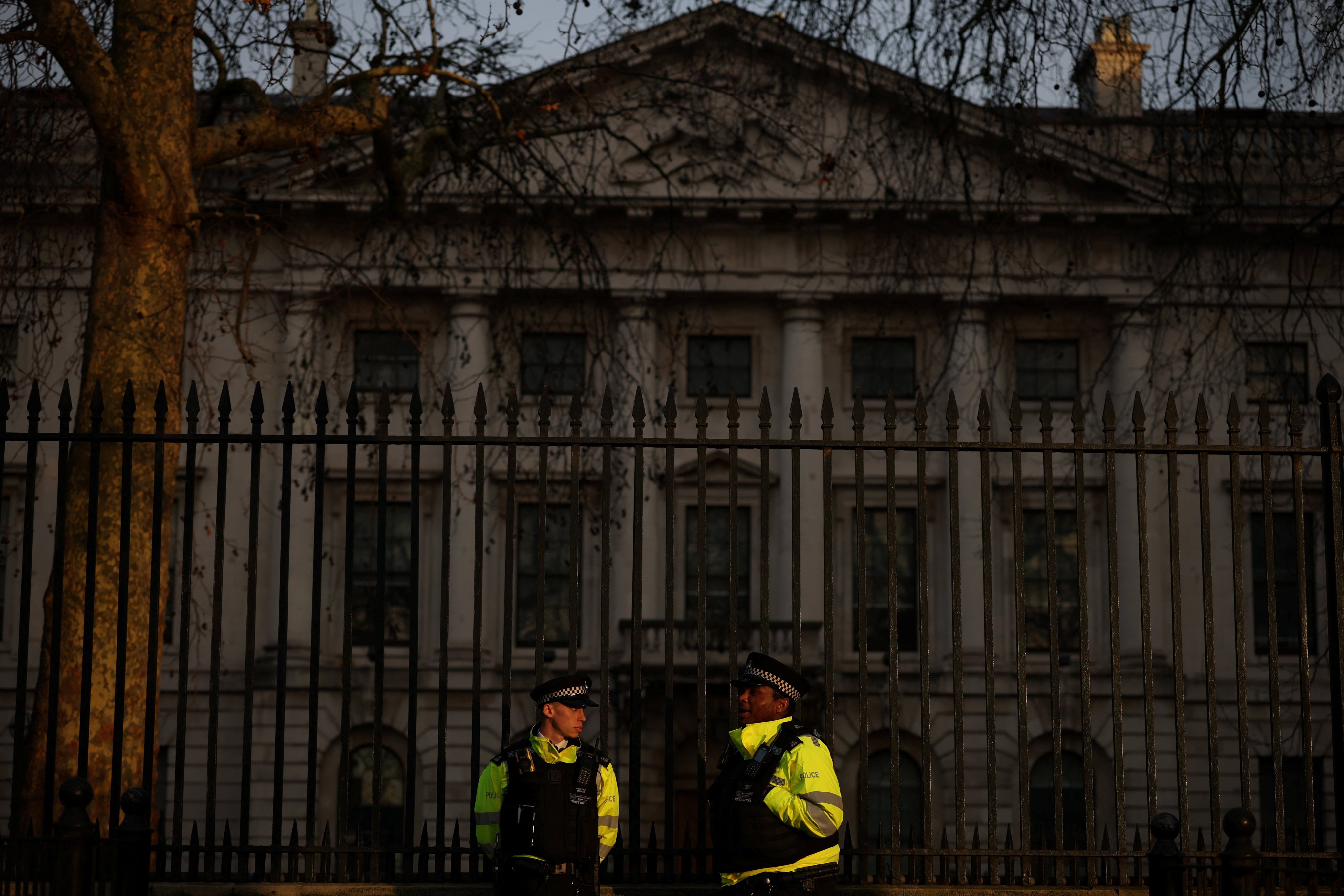 Police outside Royal Mint Court, the proposed site of a new Chinese mega-embassy, in London. The UK government says the new police body will lift the burden on the 43 local police forces in England and Wales. Photo: Reuters