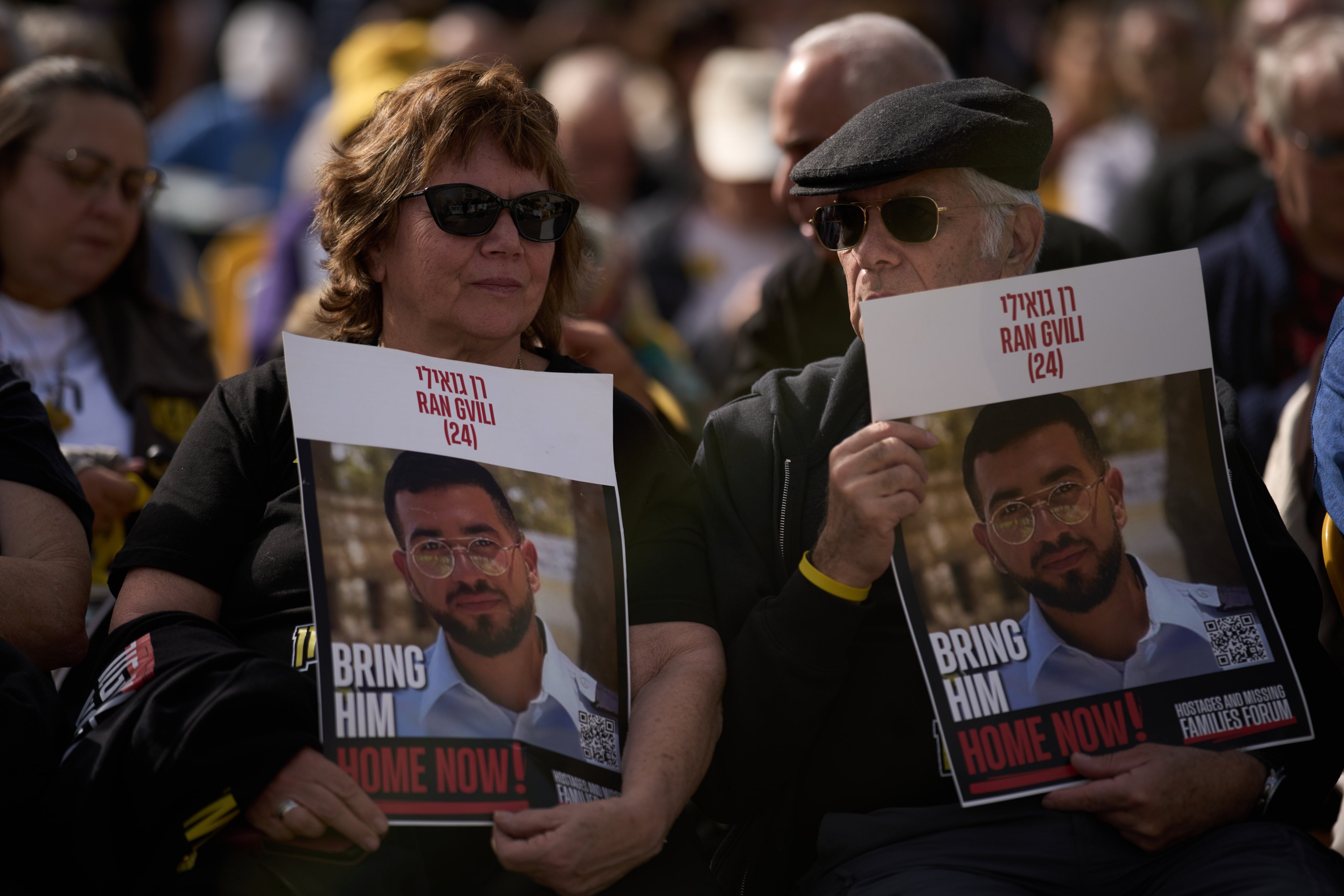 People hold signs with a photo of Ran Gvili, who was killed while fighting Hamas militants during the October 7, 2023 attack and whose body has been held in Gaza ever since, during a rally in Tel Aviv, Israel on Friday. Photo: AP