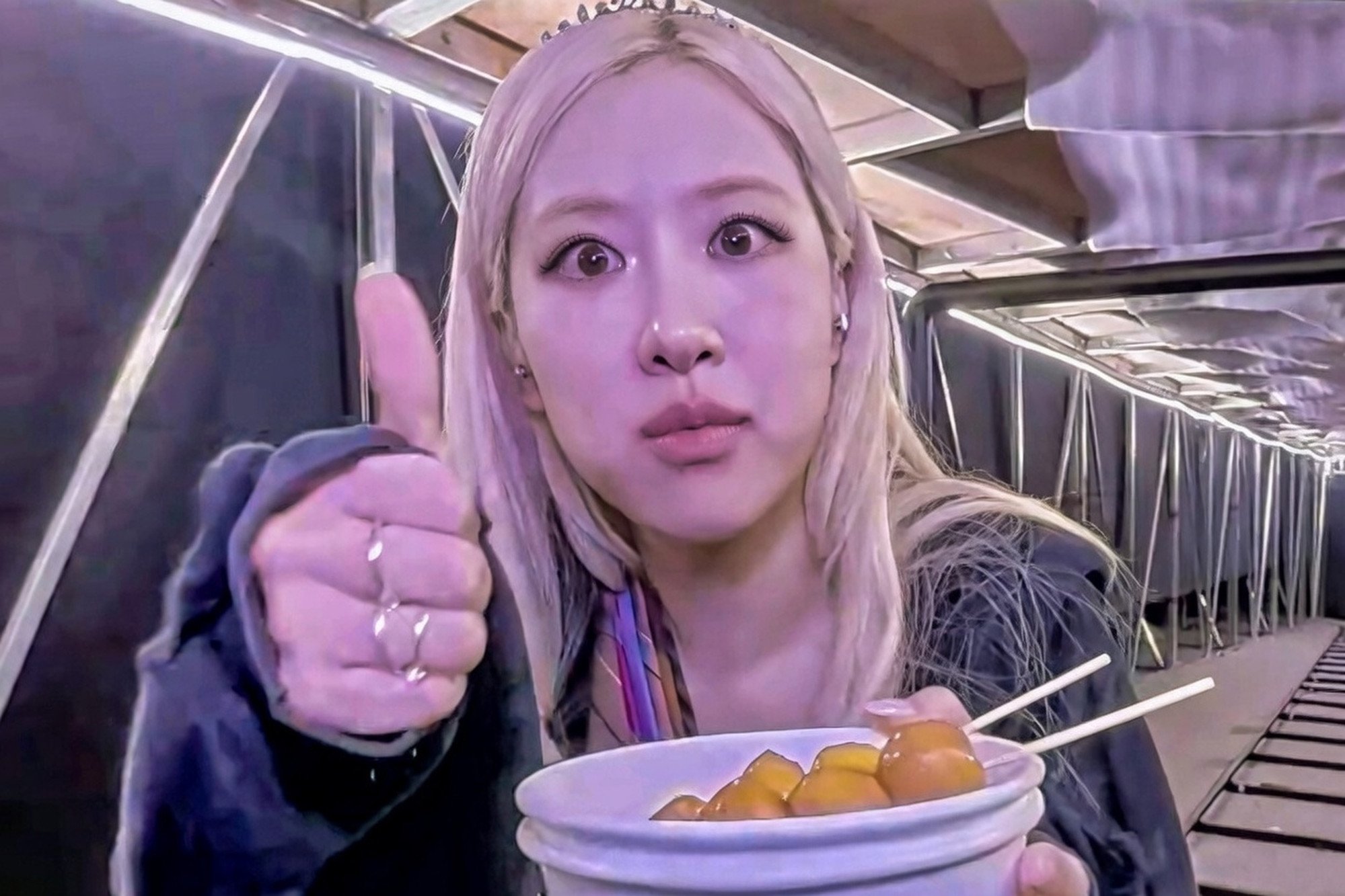 Singer Rosé tries some fish balls during the concert. Photo: Handout Singer Rosé tries some fish balls during the concert. Photo: Handout