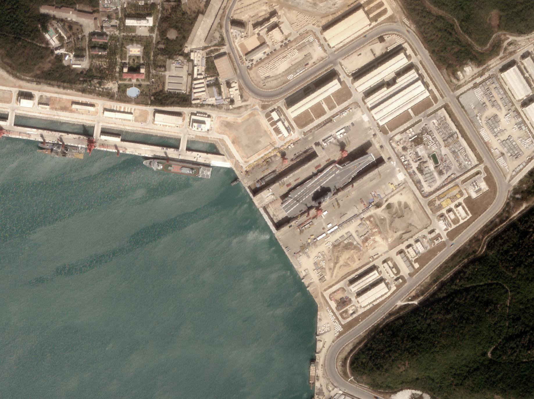 Analysis by a US geospatial intelligence company says satellite imagery shows the first use by a Chinese aircraft carrier of a new drydock near the South China Sea last week. Photo: AllSource Analysis