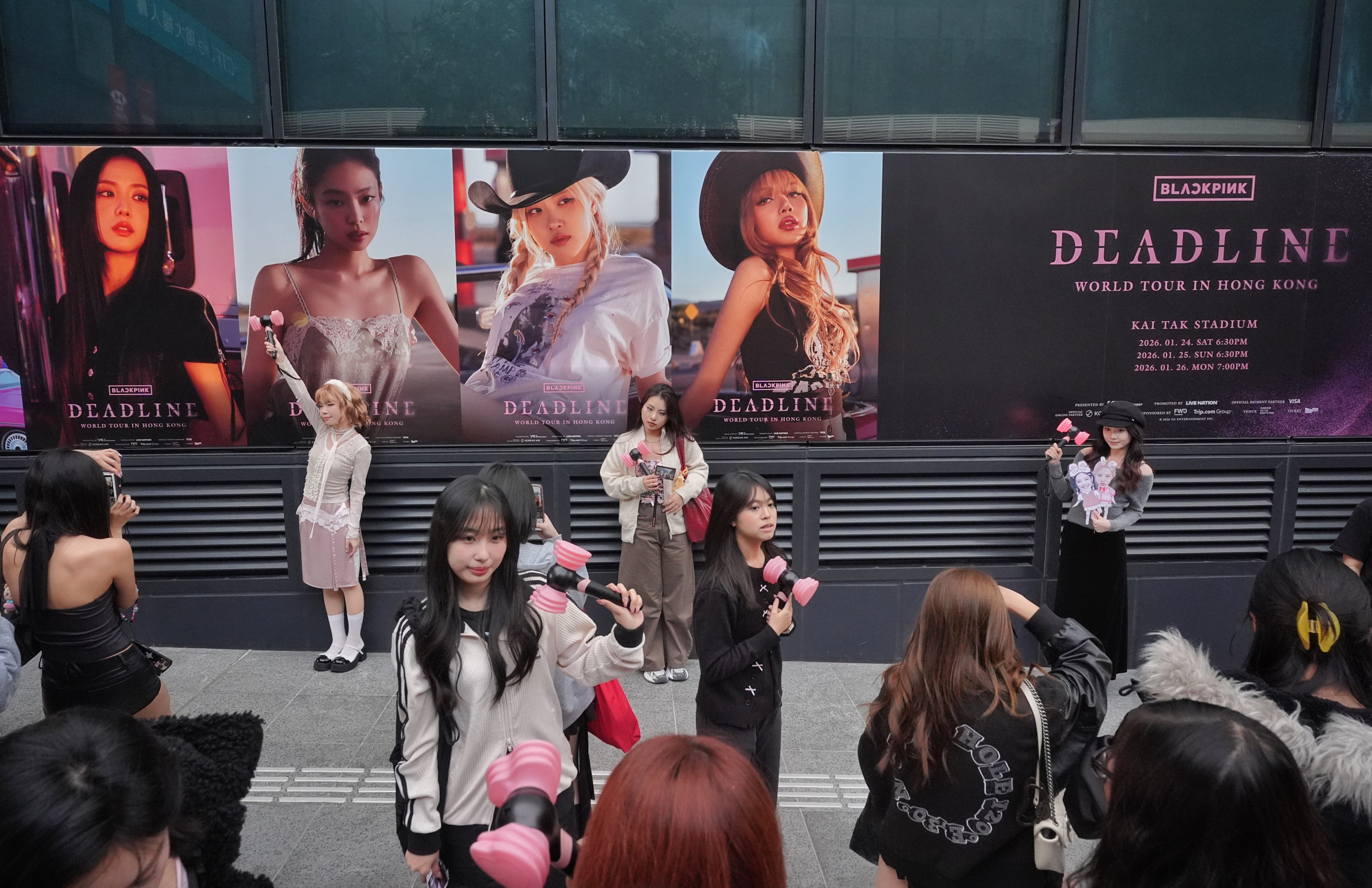 Fans of Blackpink take pictures with the billboards on the way to Kai Tak Stadium on January 24, 2026. Photo: Elson Li