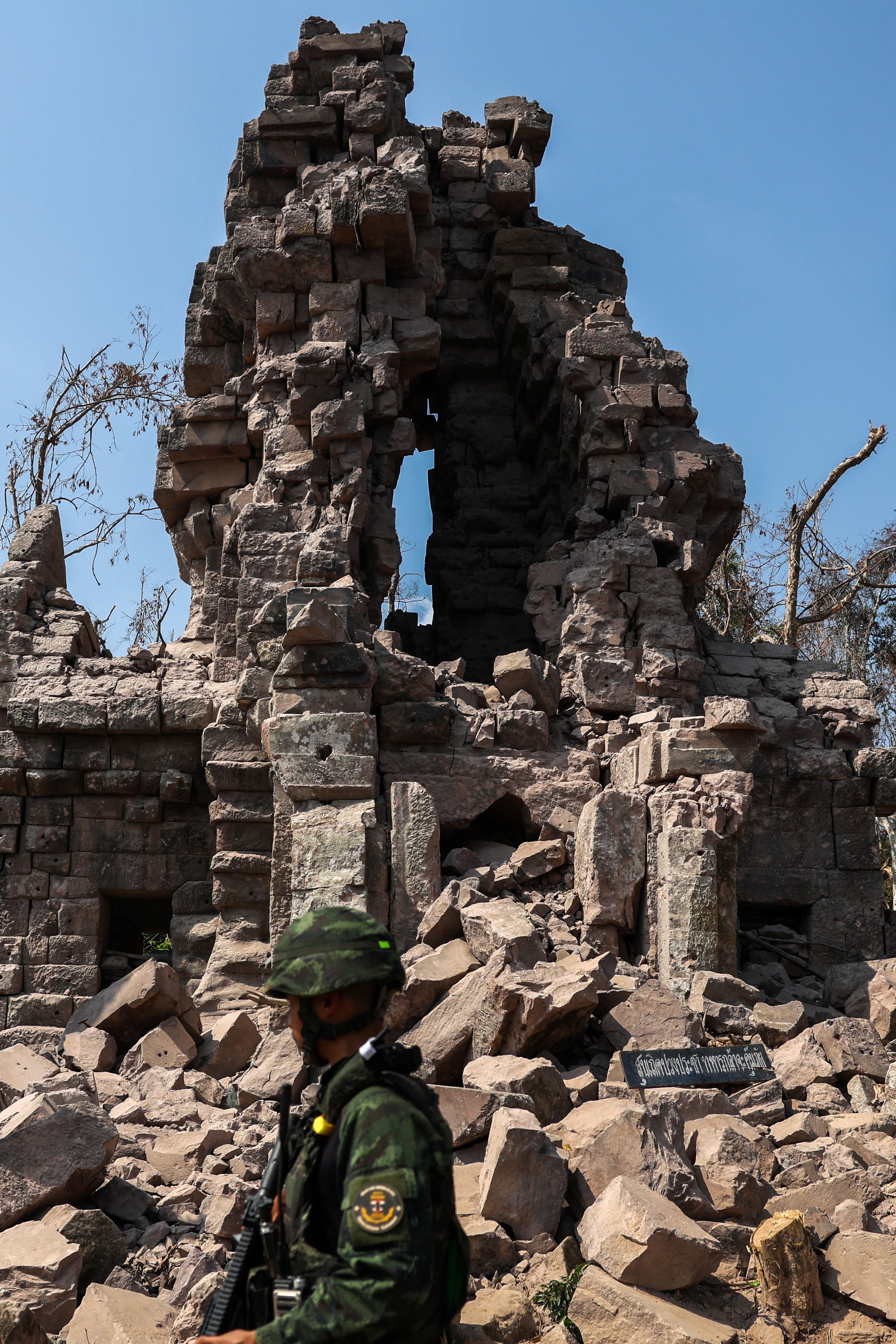 A soldier stands guard next to Prasat Ta Khwai on January 20. The temple was the site of clashes between Thailand and Cambodia in December last year. Photo: Reuters