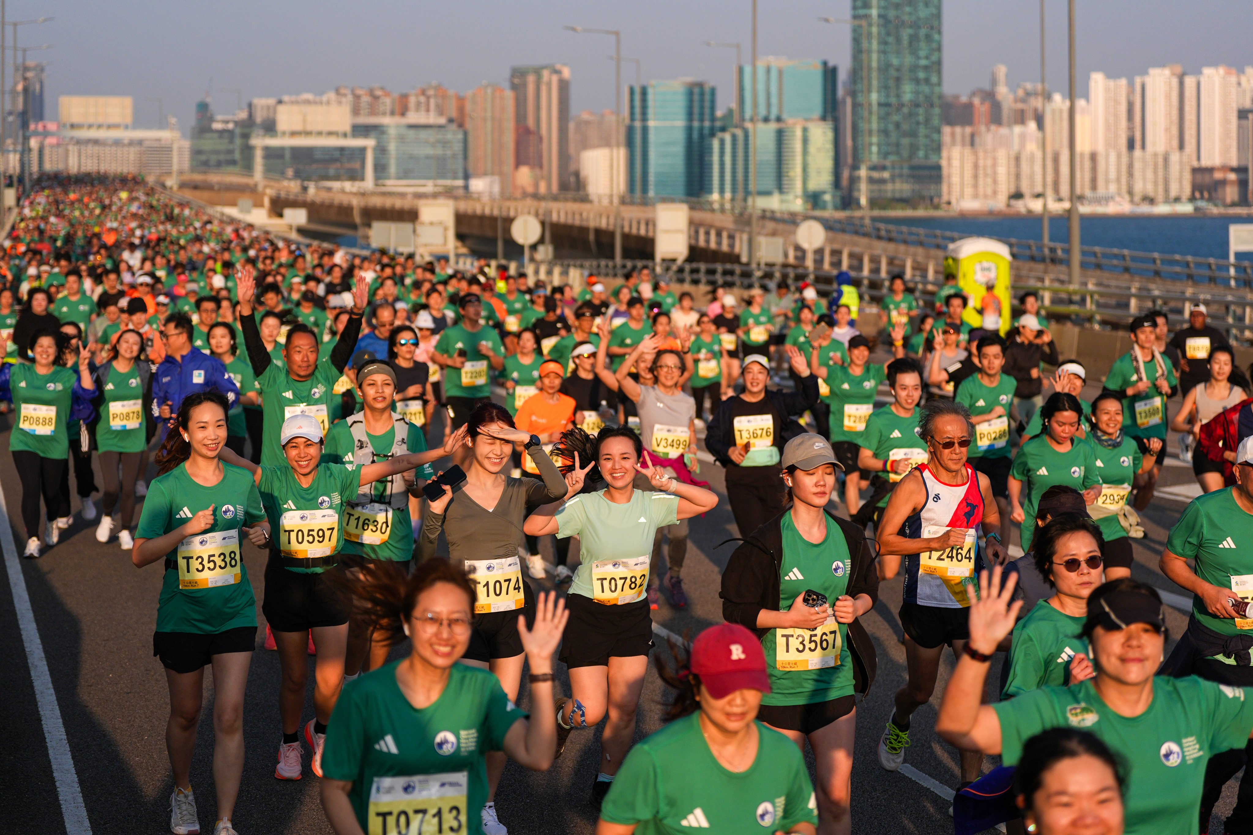 Athletes run along Island Eastern Corridor during the 10km race of the marathon. Photo: Eugene Lee