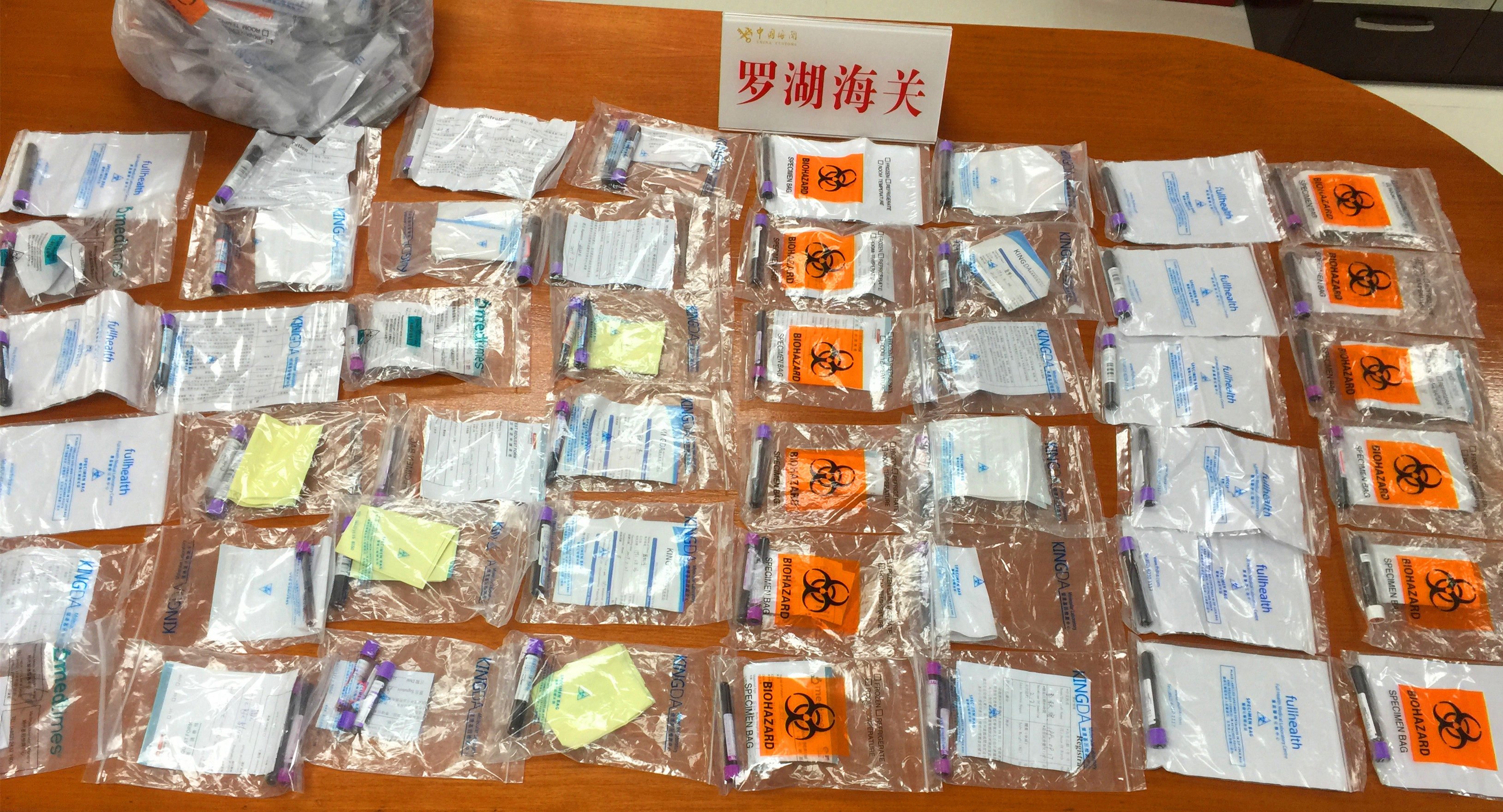 Customs officials at Shenzhen’s Luohu Port seized 142 blood samples that were found in the school bag of a 12-year-old girl crossing into Hong Kong on February 23, 2019. Photo: Handout from Luohu Port