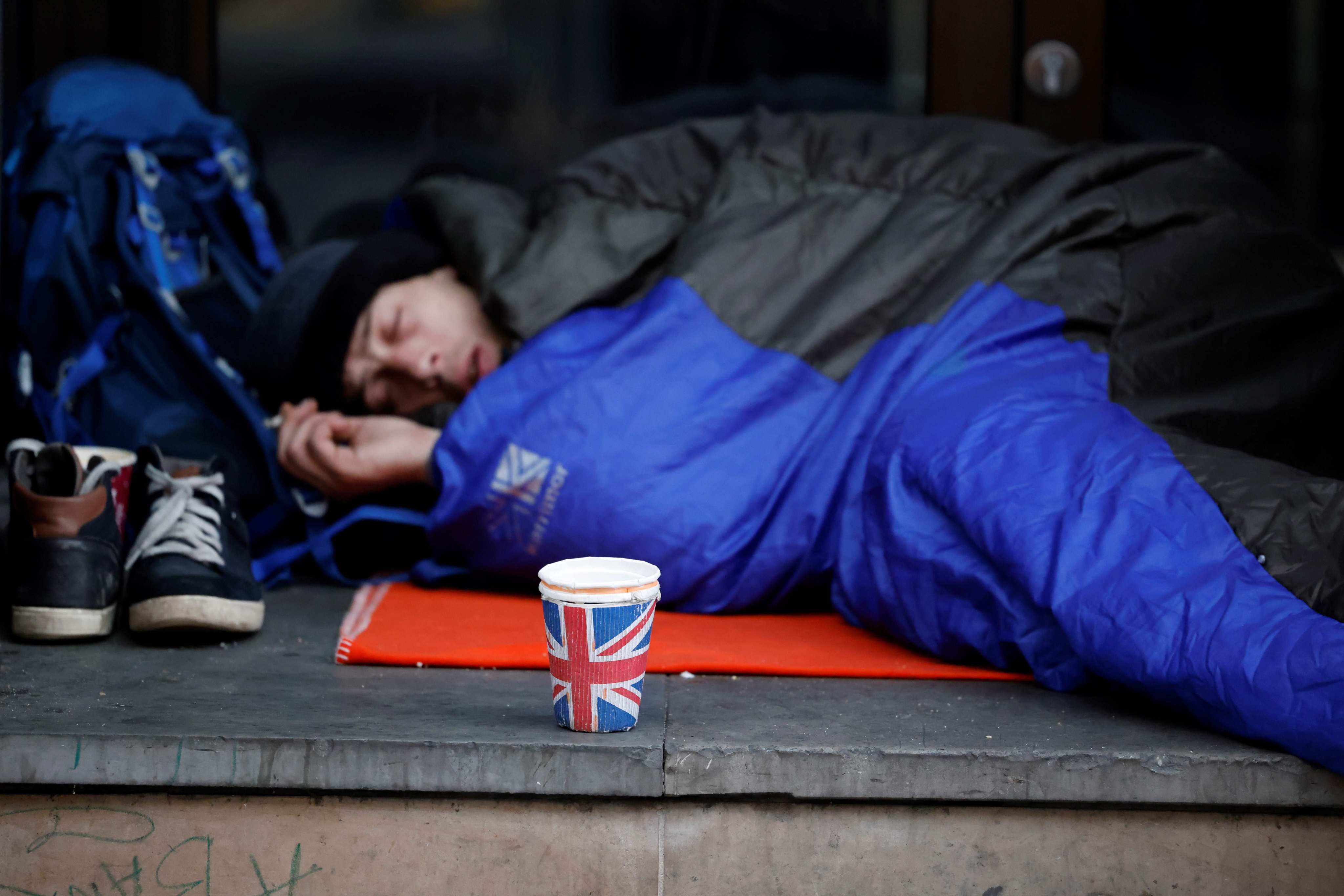 A homeless person near Piccadilly Circus in central London in 2020. Poverty in Britain has deepened in recent years. Photo: AFP