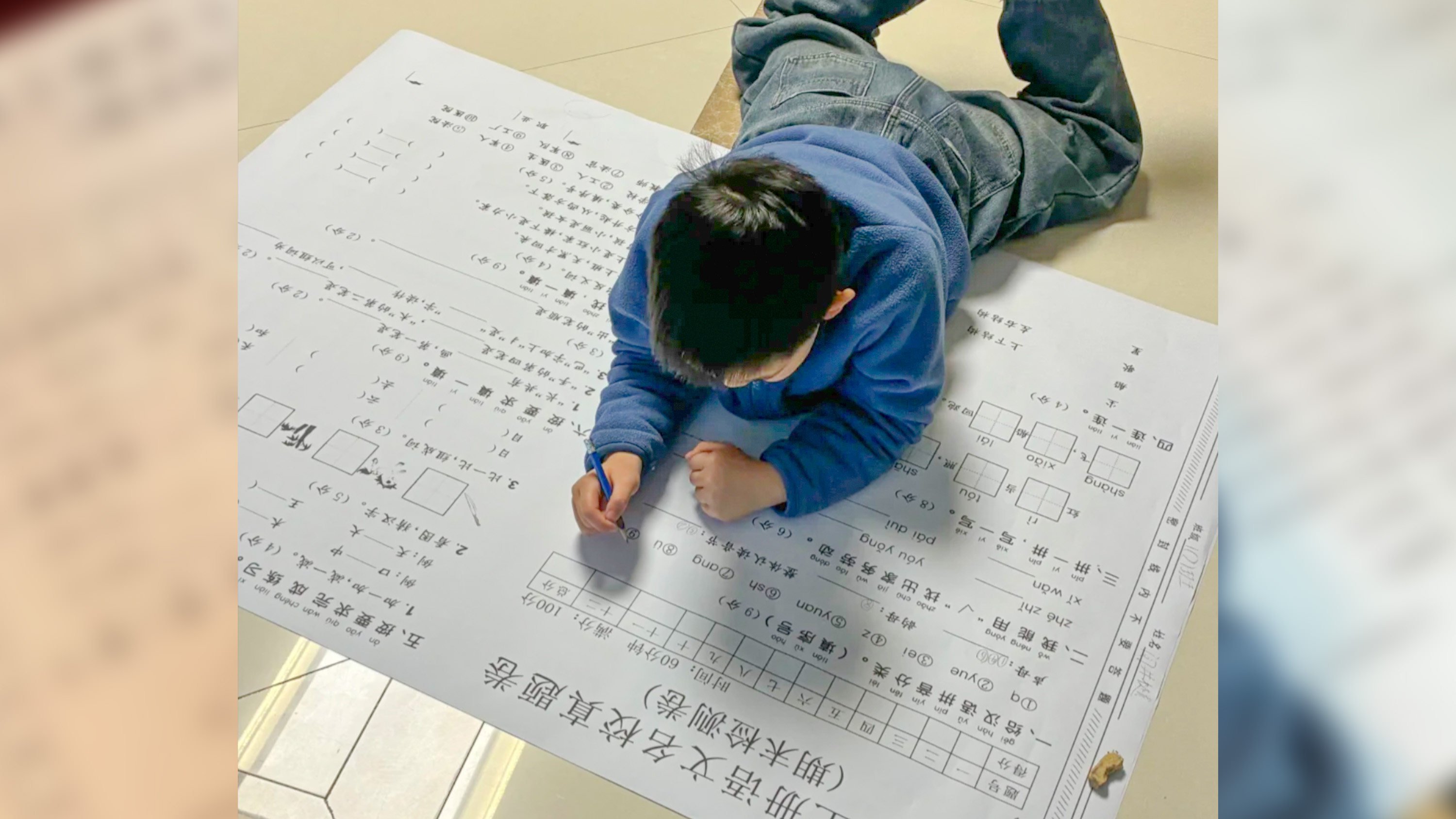 Some young parents in China have printed oversized winter holiday test papers to motivate their children to do their homework. Photo: RedNote