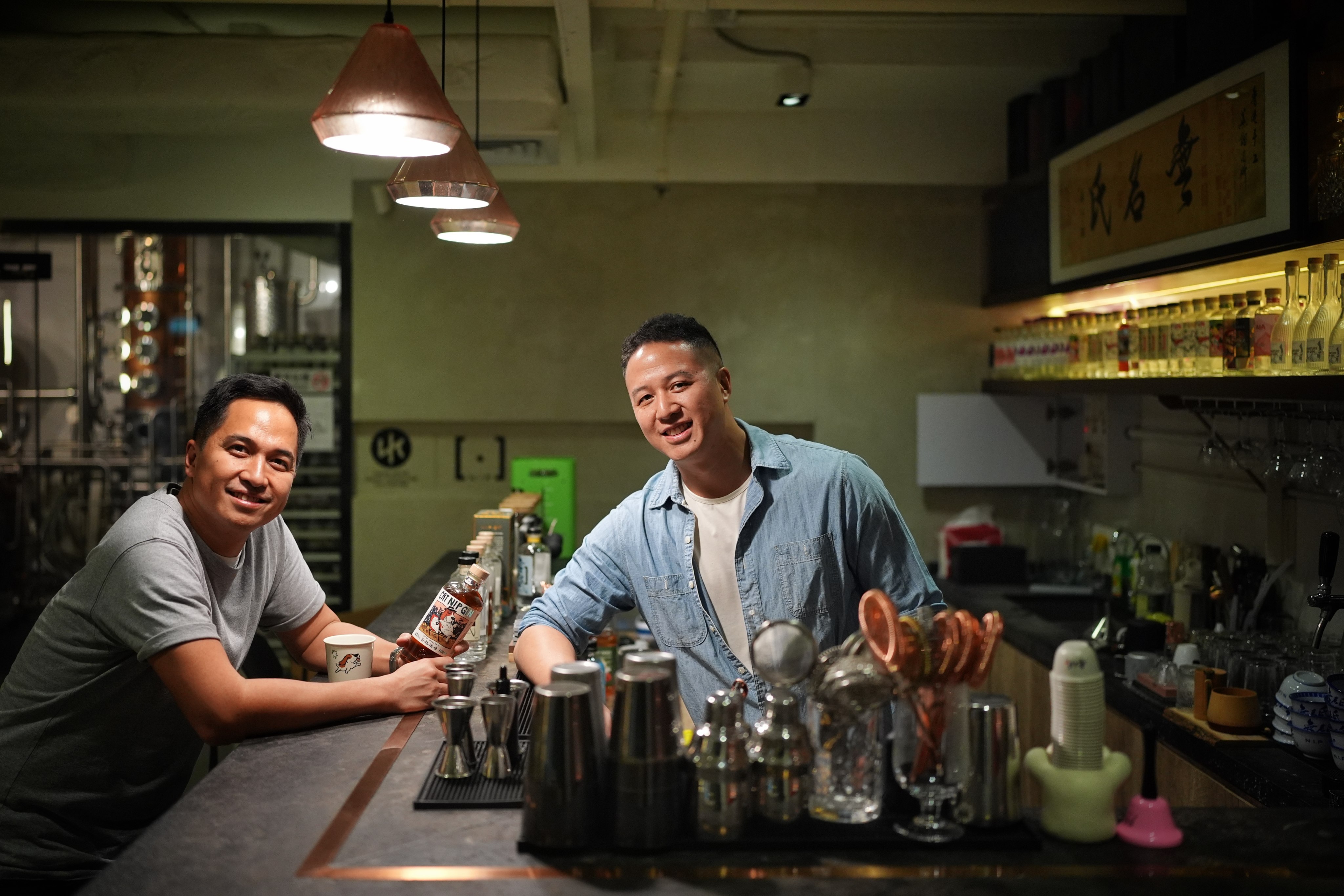 NIP Distilling founders Jeremy Li (left) and Nicholas Law are pictured at their gin distillery in Hong Kong’s Quarry Bay neighbourhood. The pair, who built the brand from the ground up, are seeing their tipple take off in Hong Kong and beyond. Photo: Elson Li