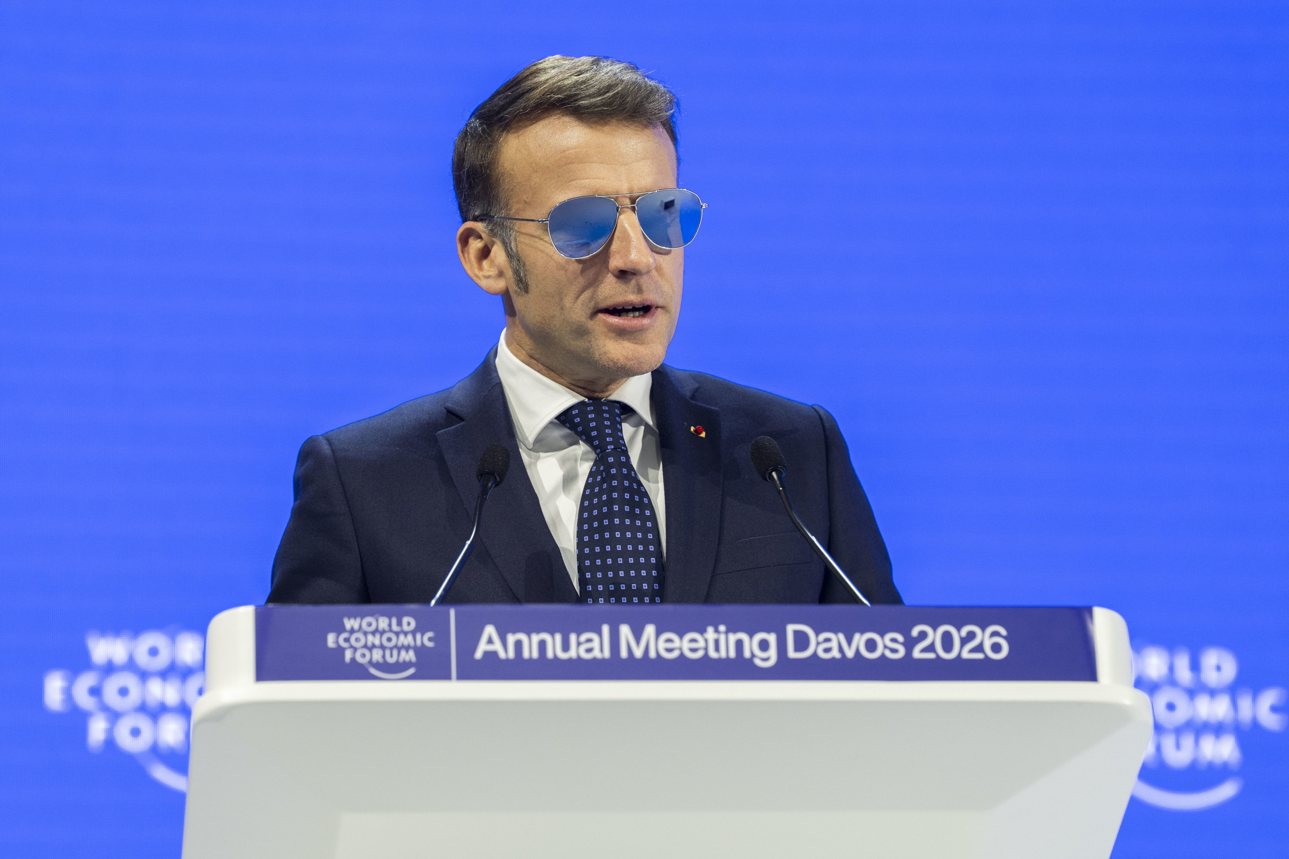 French President Emmanuel Macron, wearing aviator sunglasses due to an eye condition, delivers a speech during the World Economic Forum annual meeting in Davos, Switzerland, on Tuesday. Photo: Valeriano Di Domenico/World Ecomonic Forum/dpa