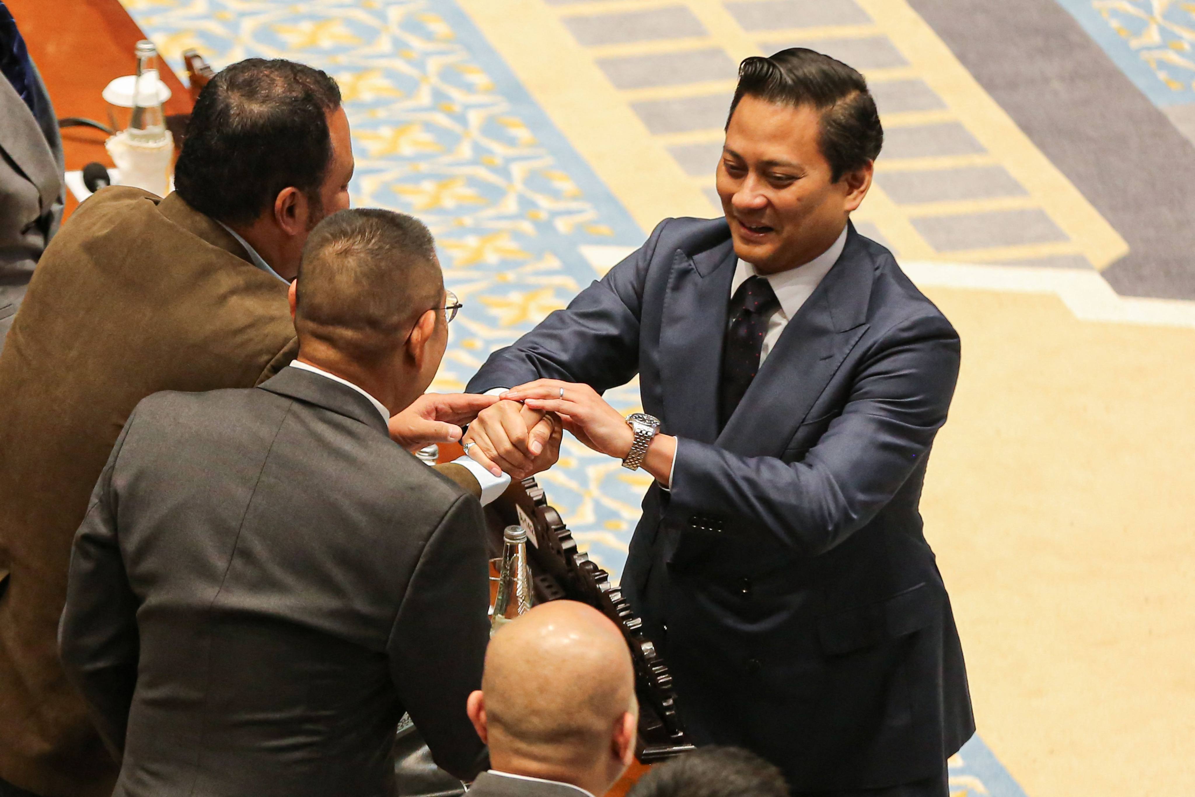 Bank Indonesia Deputy Governor-elect Thomas Djiwandono (right) reacts after lawmakers approved his appointment during a plenary session at the Parliament Complex in Jakarta on Tuesday. Photo: AFP