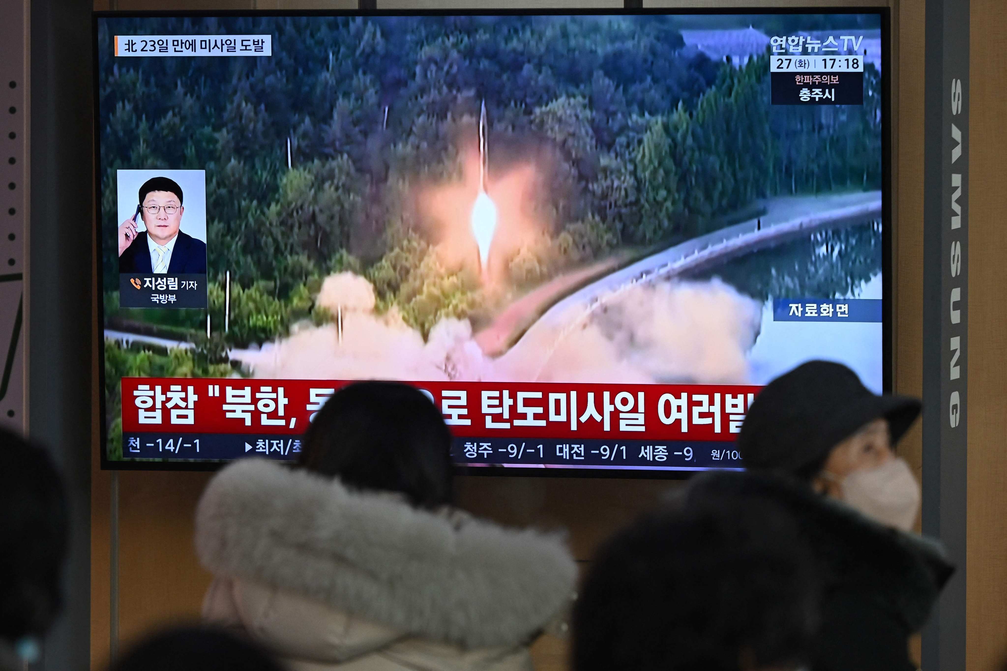 A television screen showing a news broadcast with file footage of a North Korean missile test at a railway station in Seoul on Tuesday. Photo: AFP