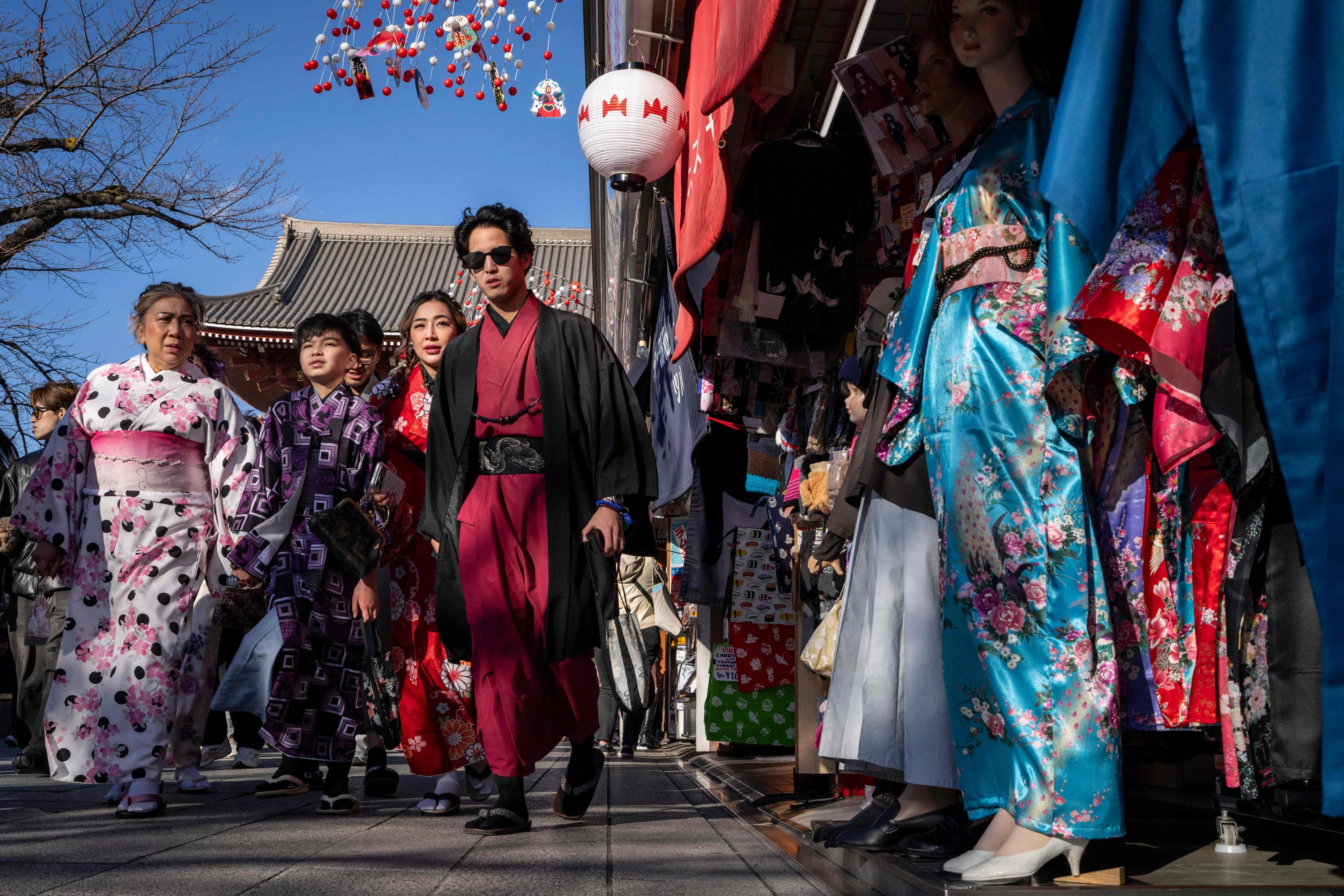 People walk through the Nakamise Shopping Street at the Asakusa district in Tokyo on January 8, 2026. Photo: AFP