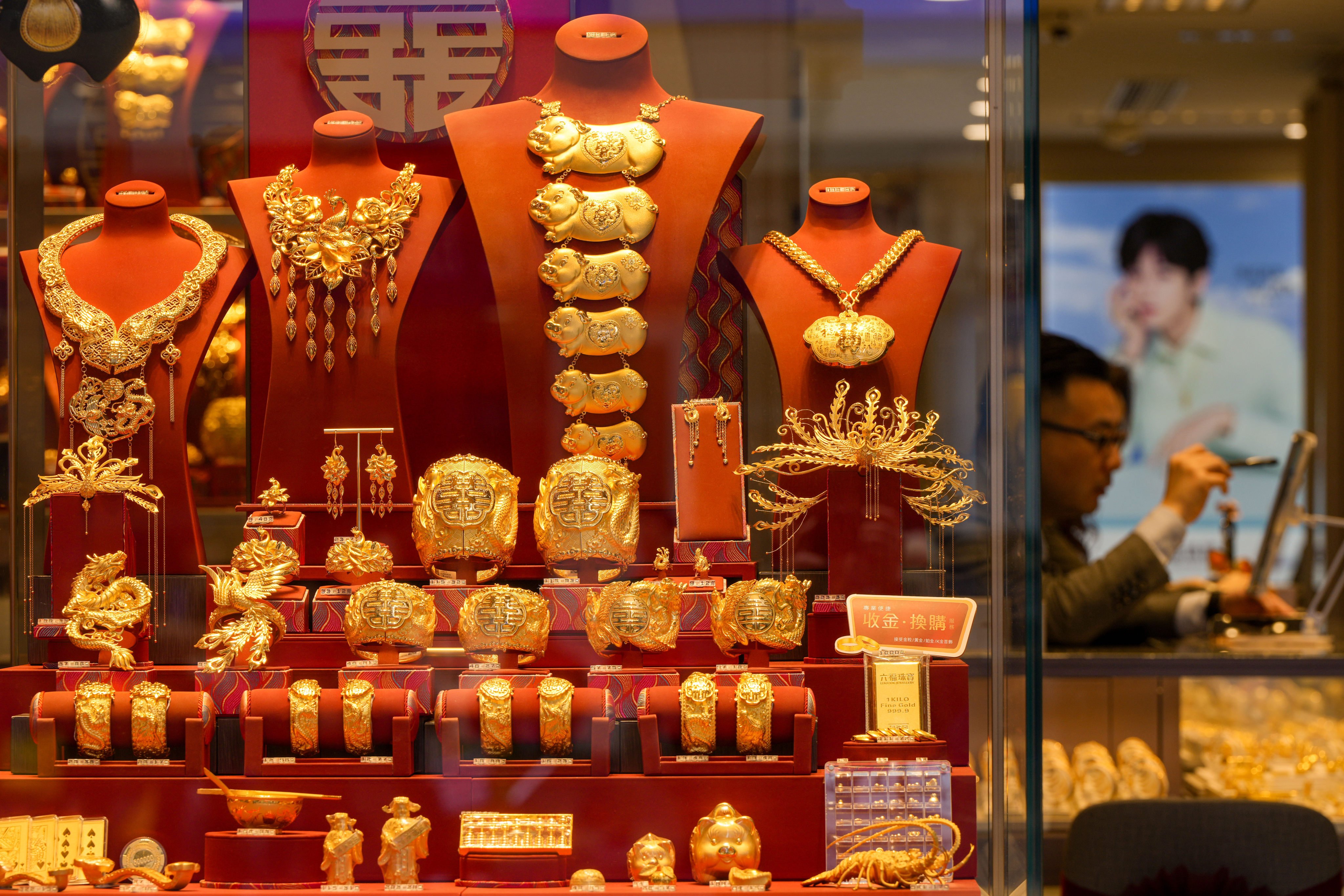 Gold products displayed in a jewellery shop in Tsim Sha Tsui. Gold has surged above US$5,100 an ounce, with analysts forecasting further gains. Photo: Sam Tsang